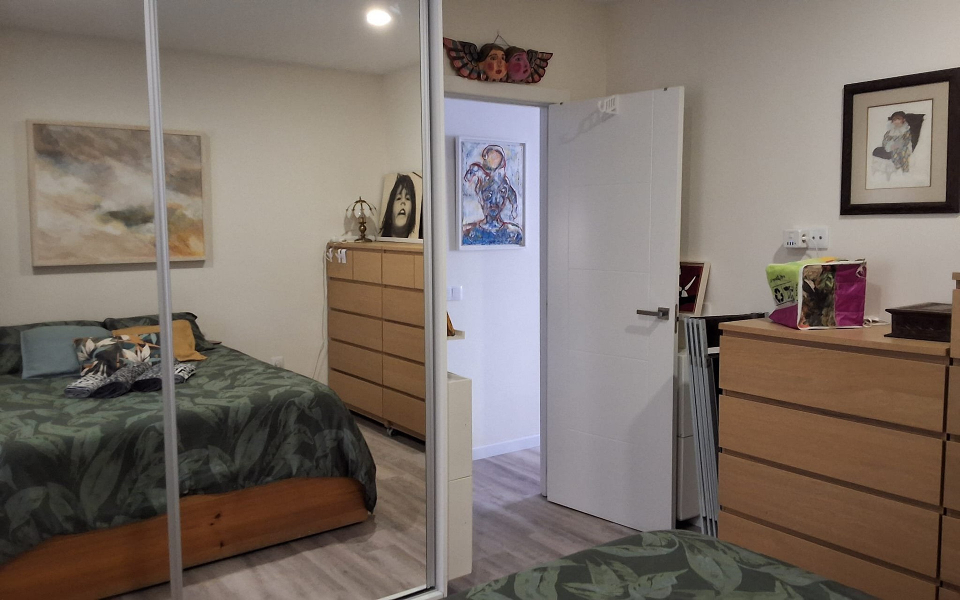 Bedroom with mirrored closet doors