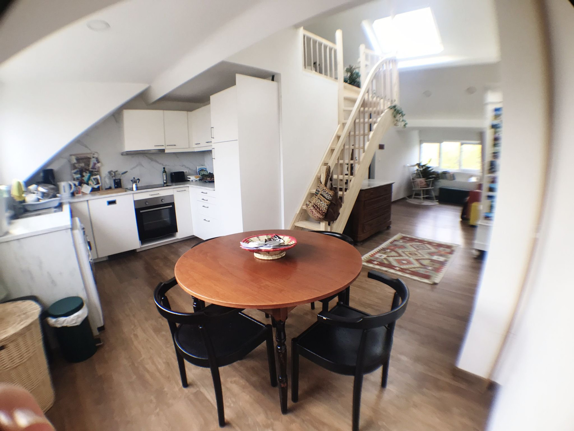 Open kitchen and round dining table