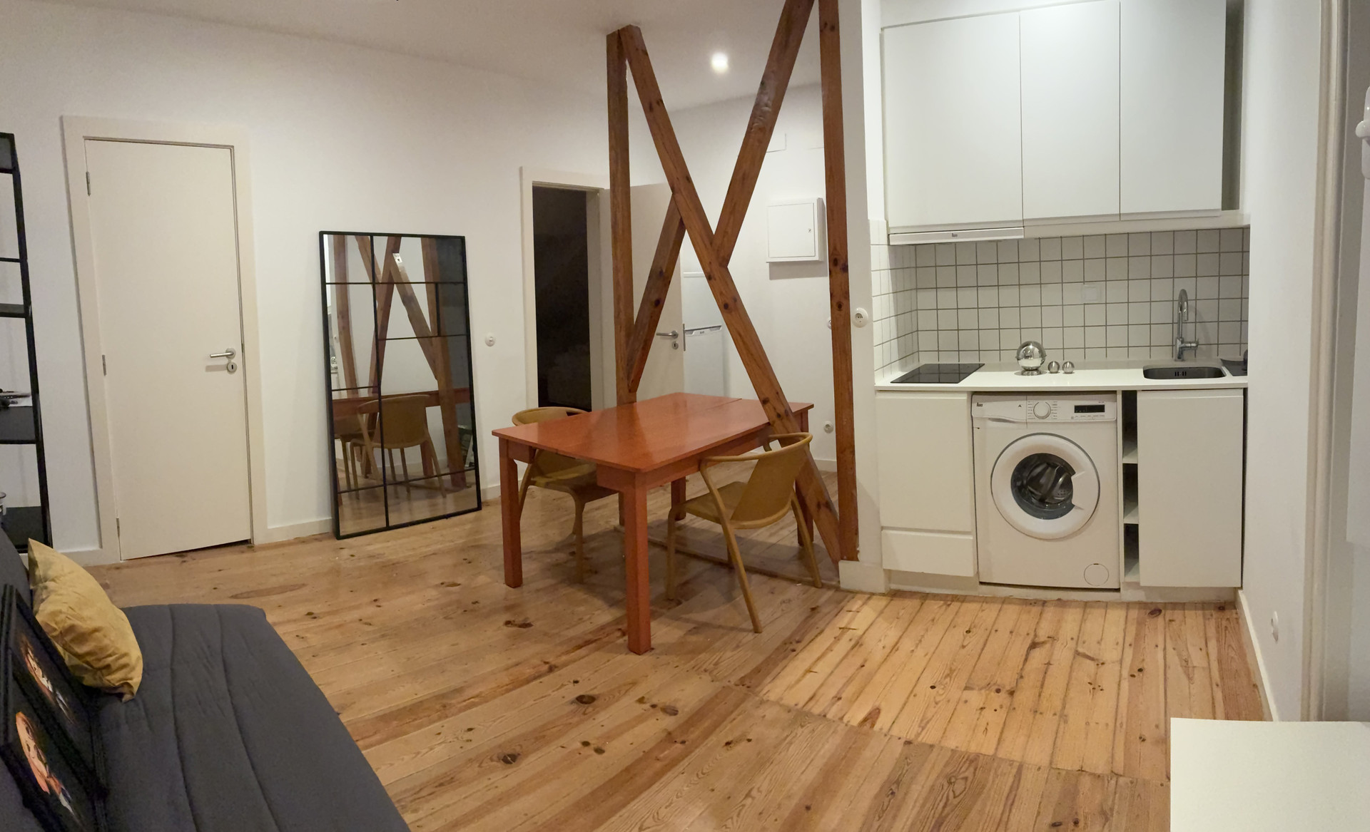 Kitchenette with dining table and washer