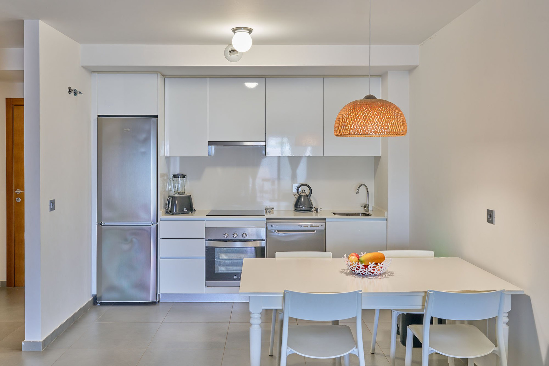 Modern white kitchen dining area
