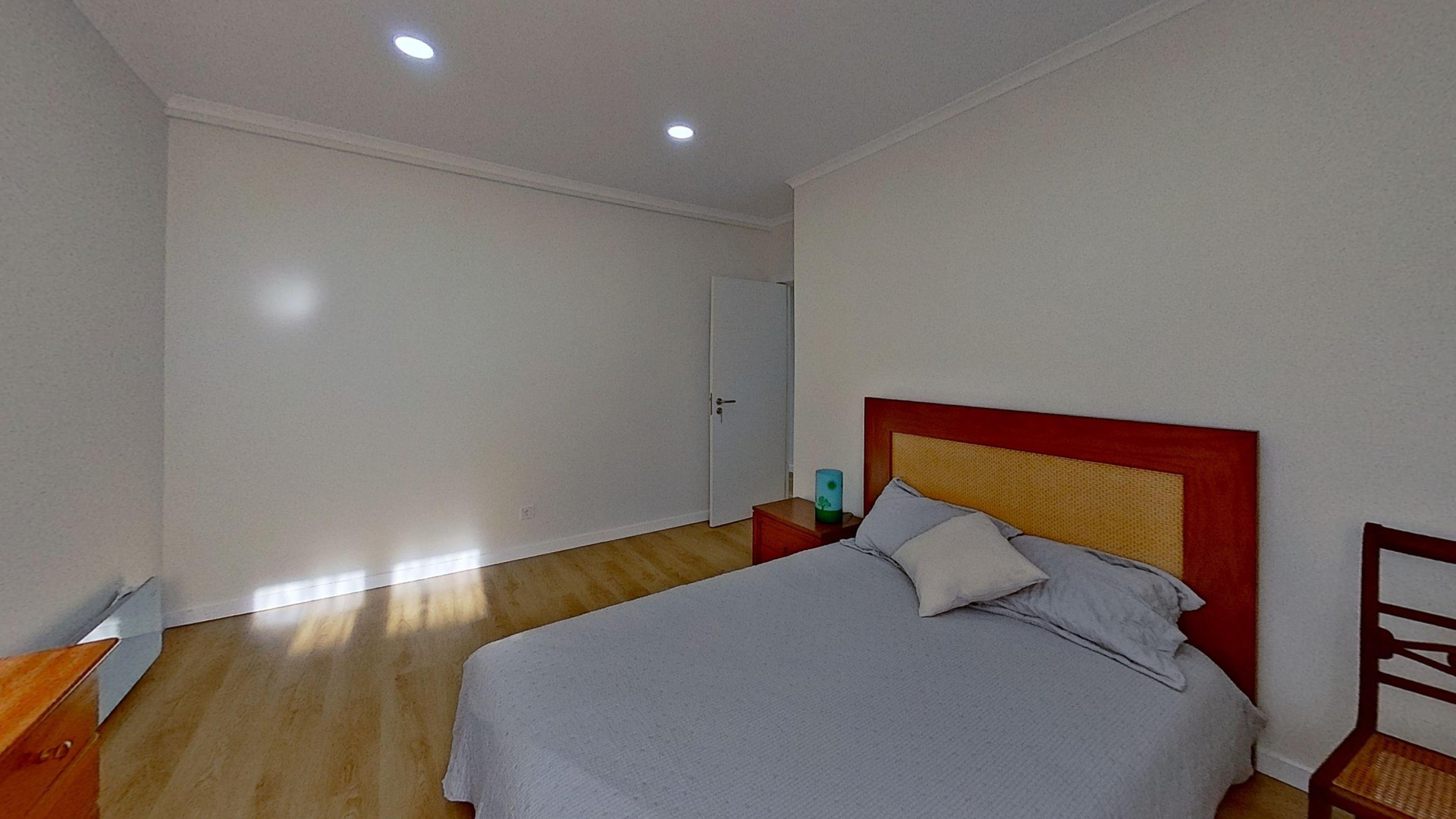 Bedroom with red headboard bed