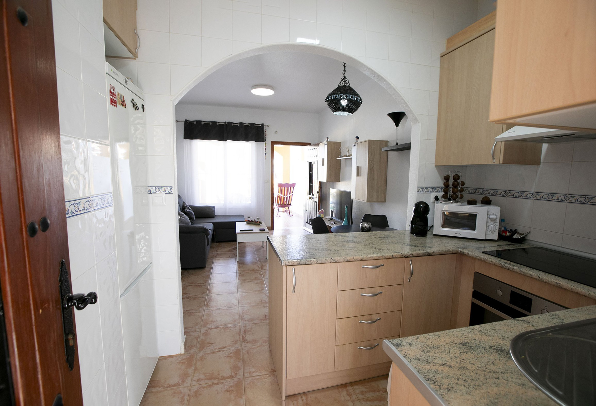 Kitchen with view to living room