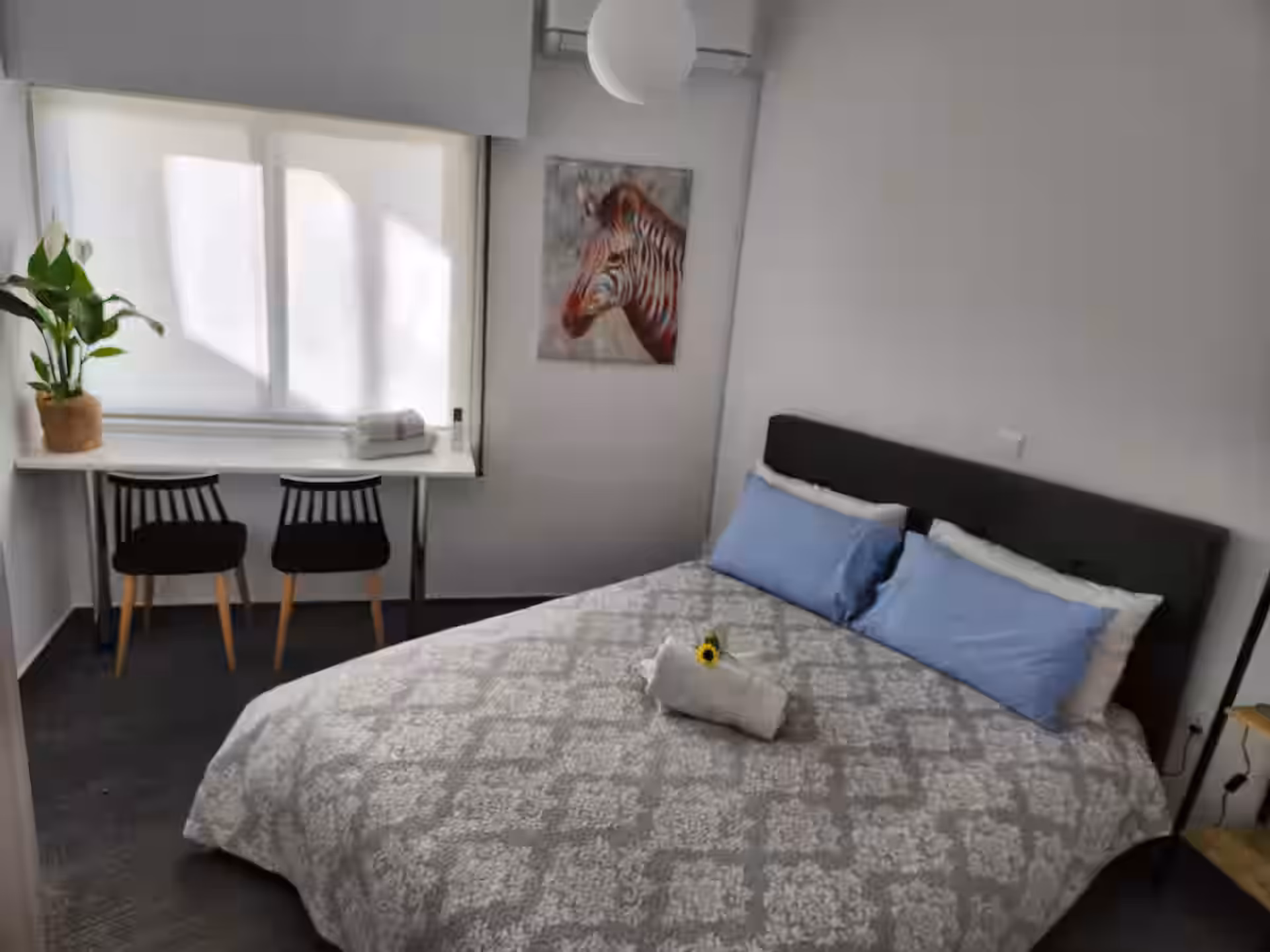 Bright bedroom with double bed