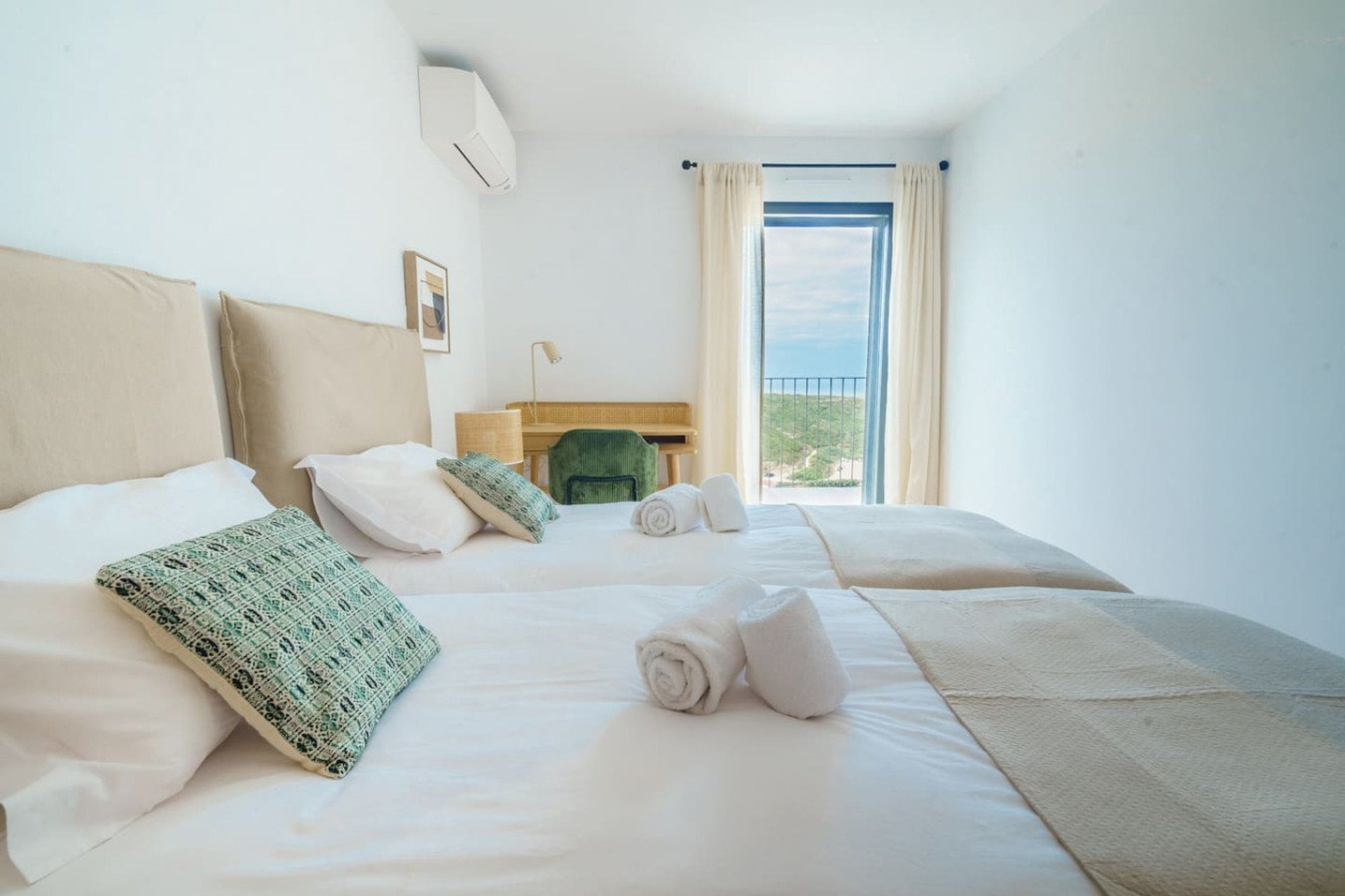 Twin bedroom with balcony view