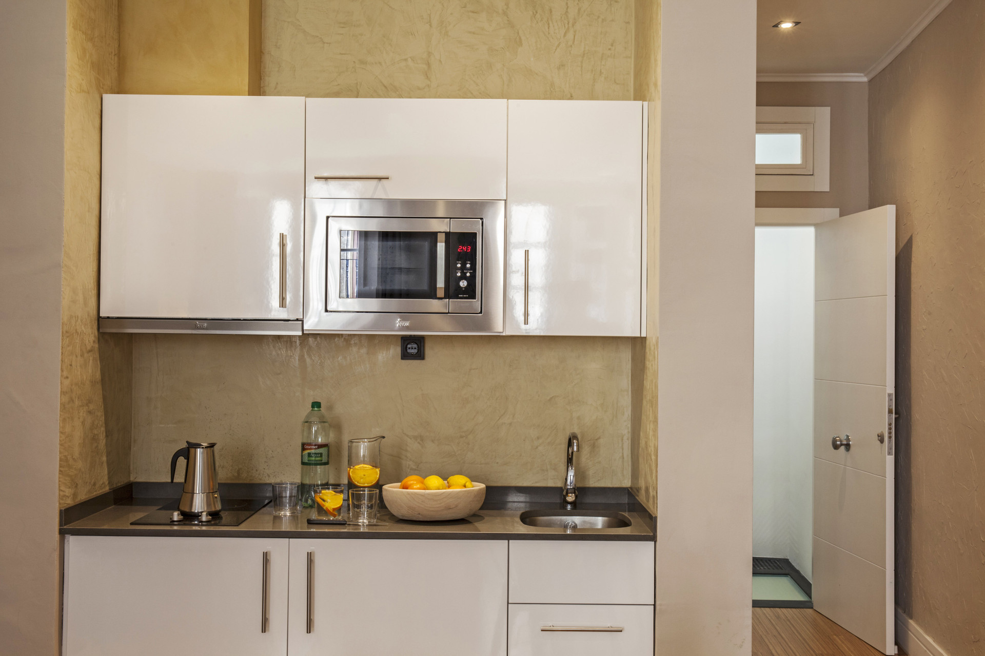 Compact kitchenette with microwave and sink