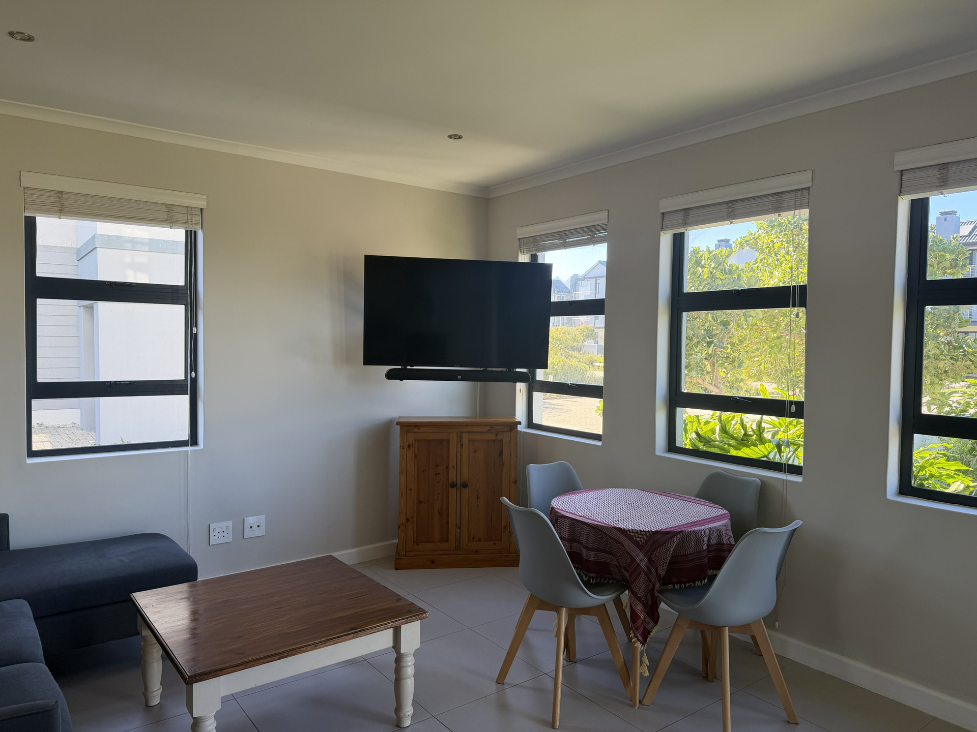Living dining area with wall TV