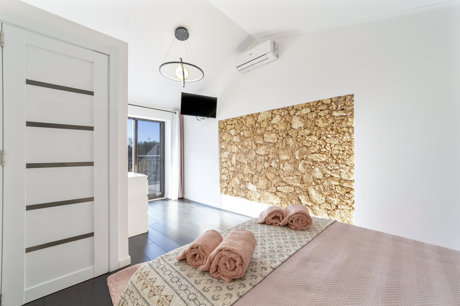 Bedroom with stone accent wall