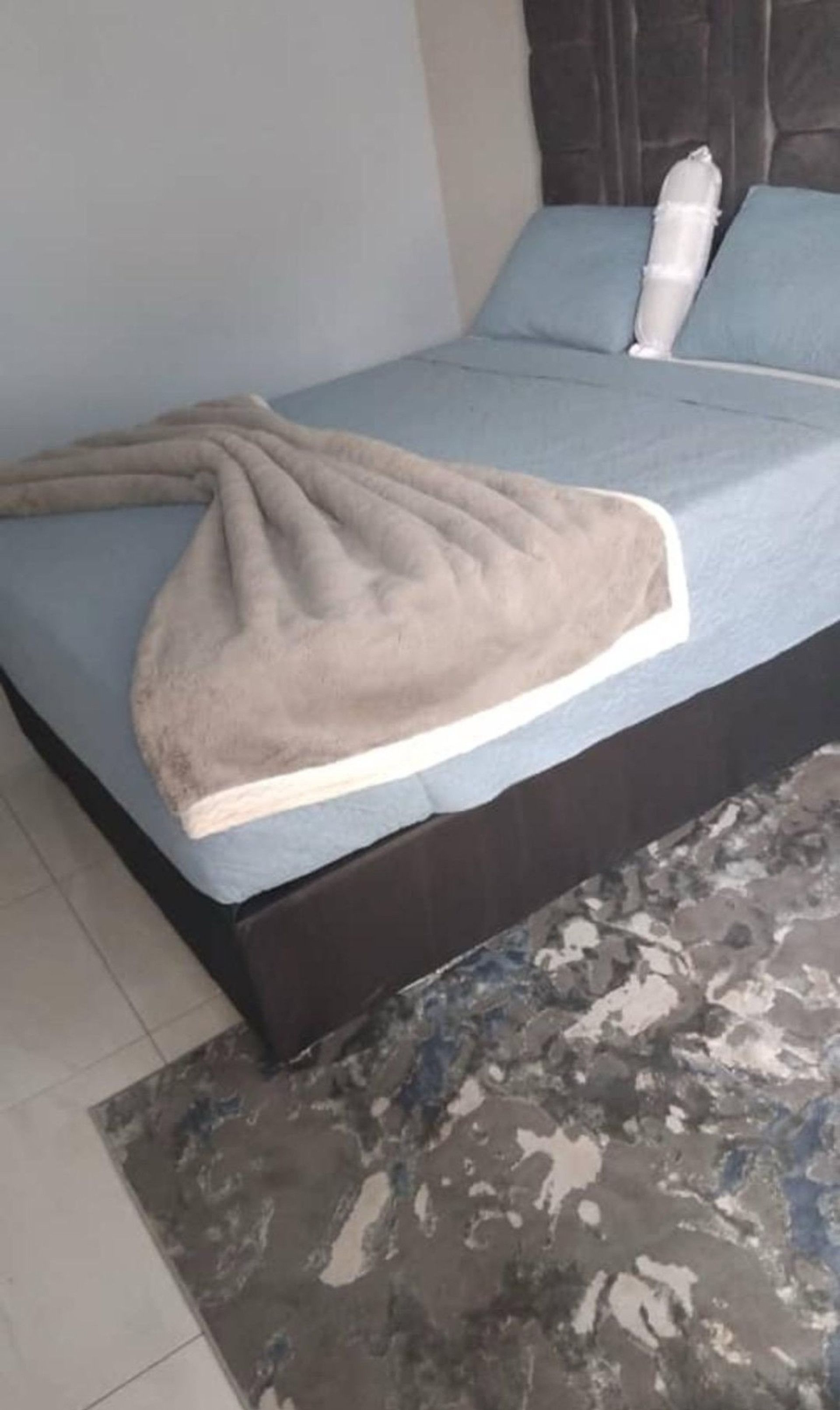Cozy bedroom with blue bedding