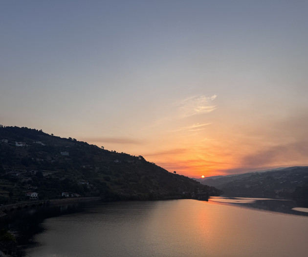 Sunset over river and hills