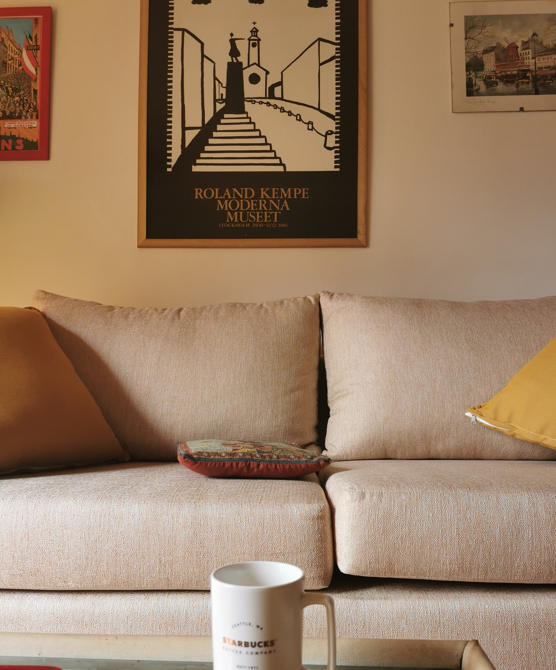 Cozy sofa with artwork closeup