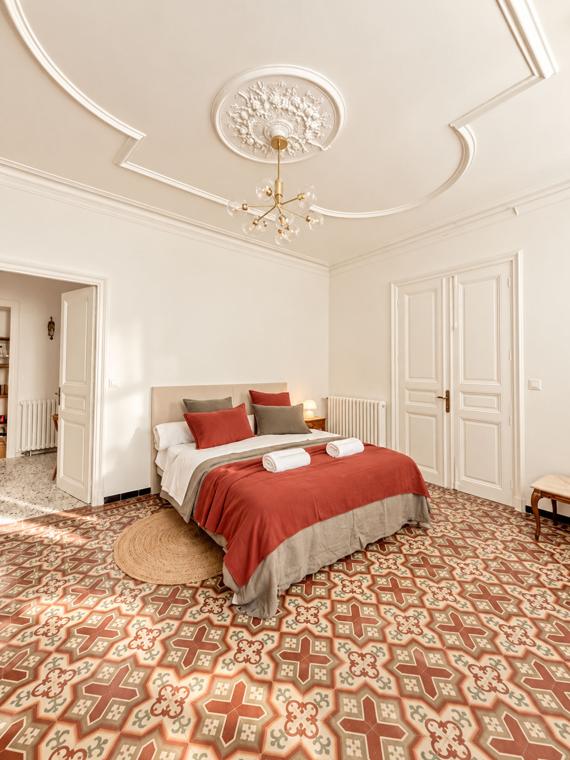 Spacious bedroom with patterned tiles