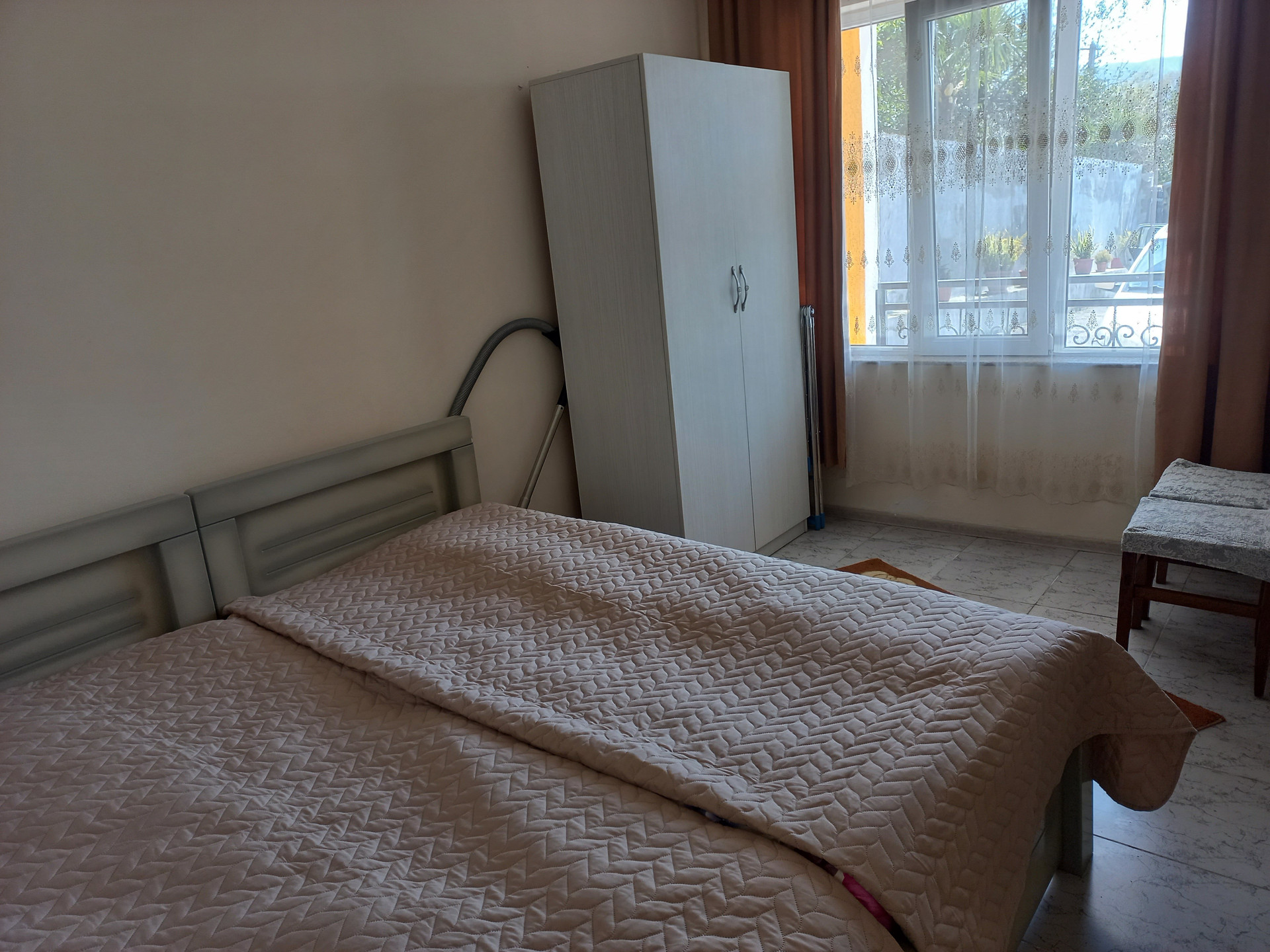 Bedroom with wardrobe and window