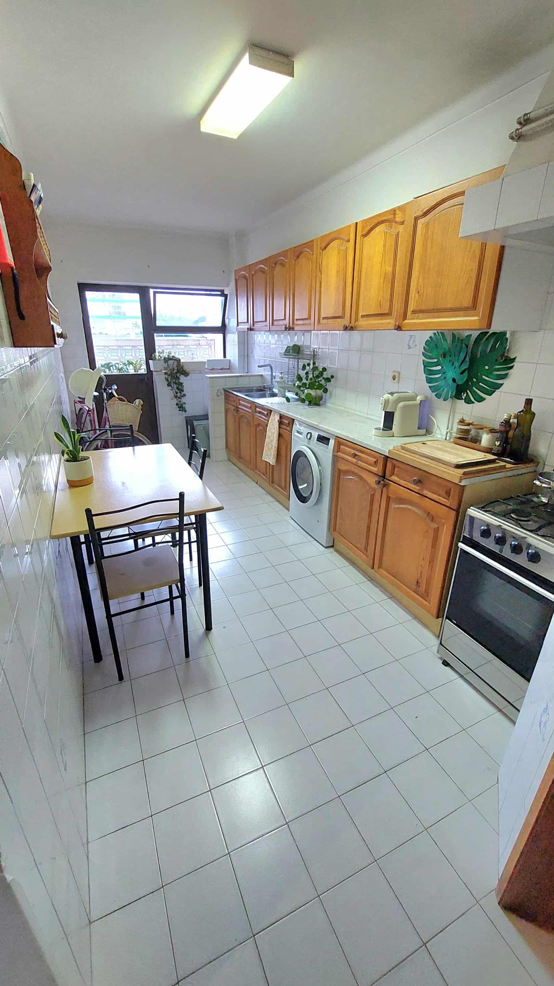 Kitchen with dining table and appliances