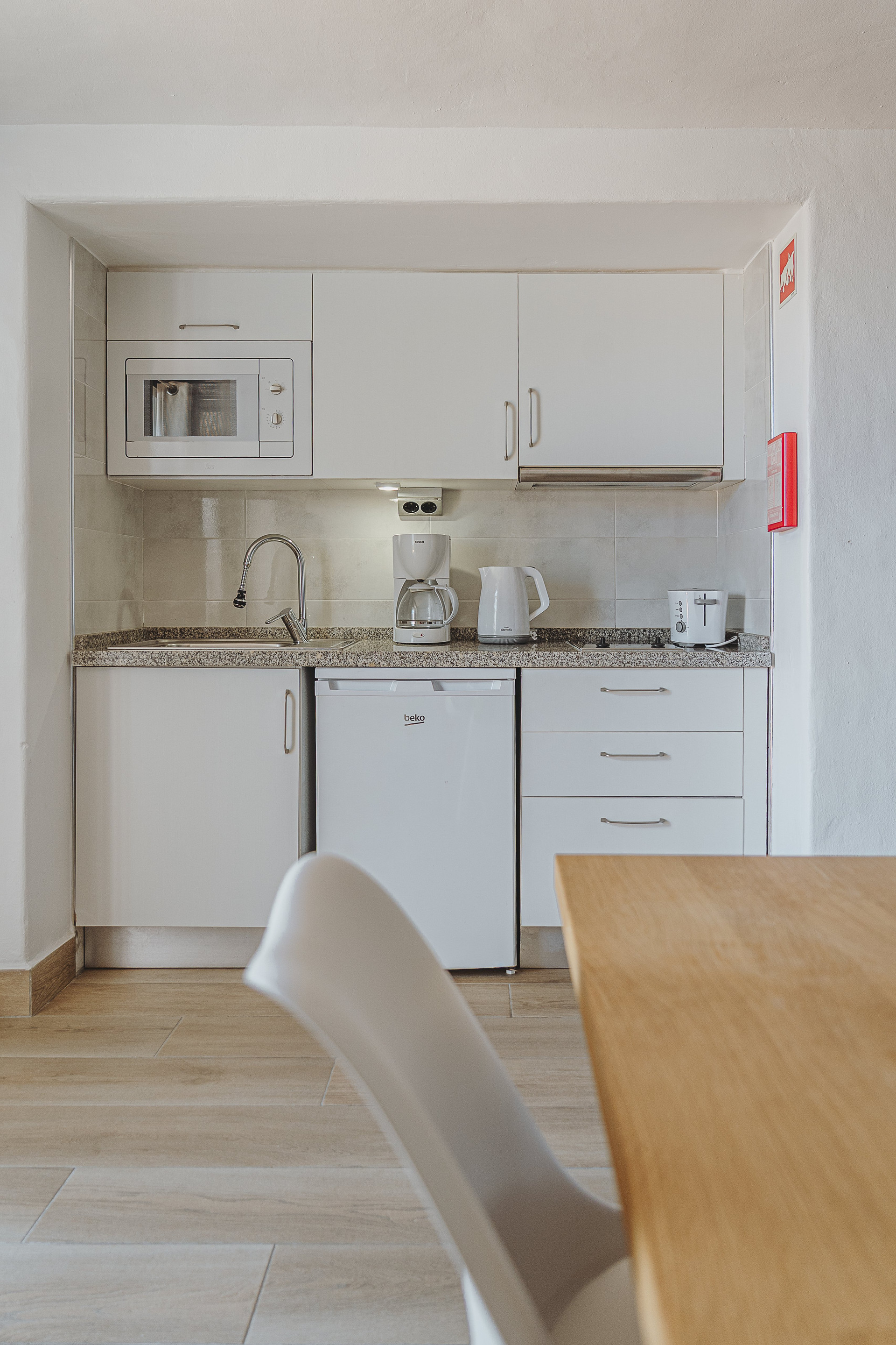 Compact kitchenette with dining table