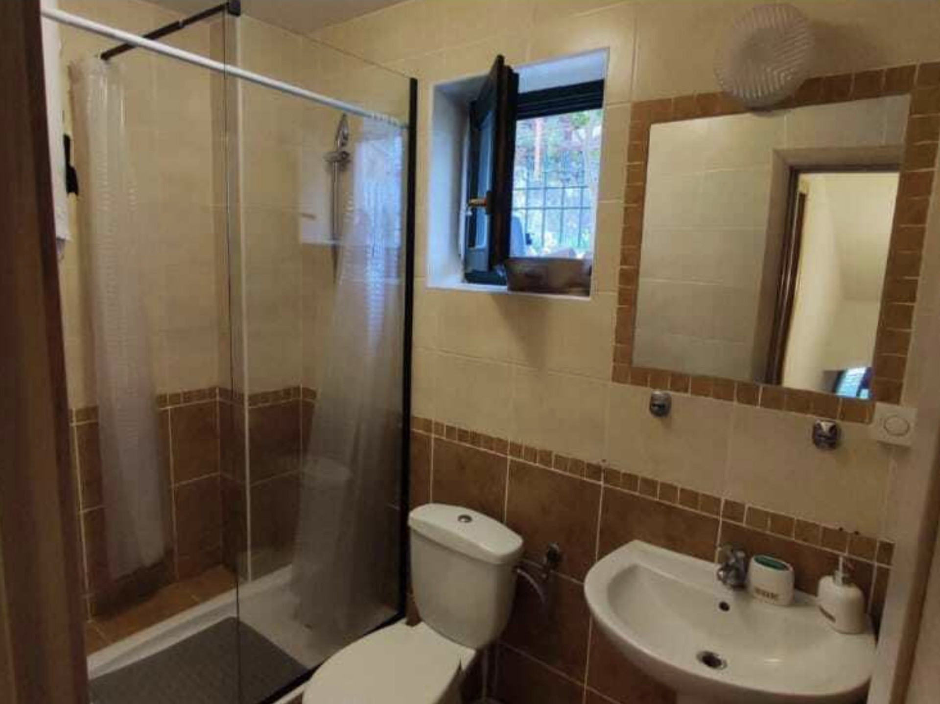 Bathroom with shower and sink