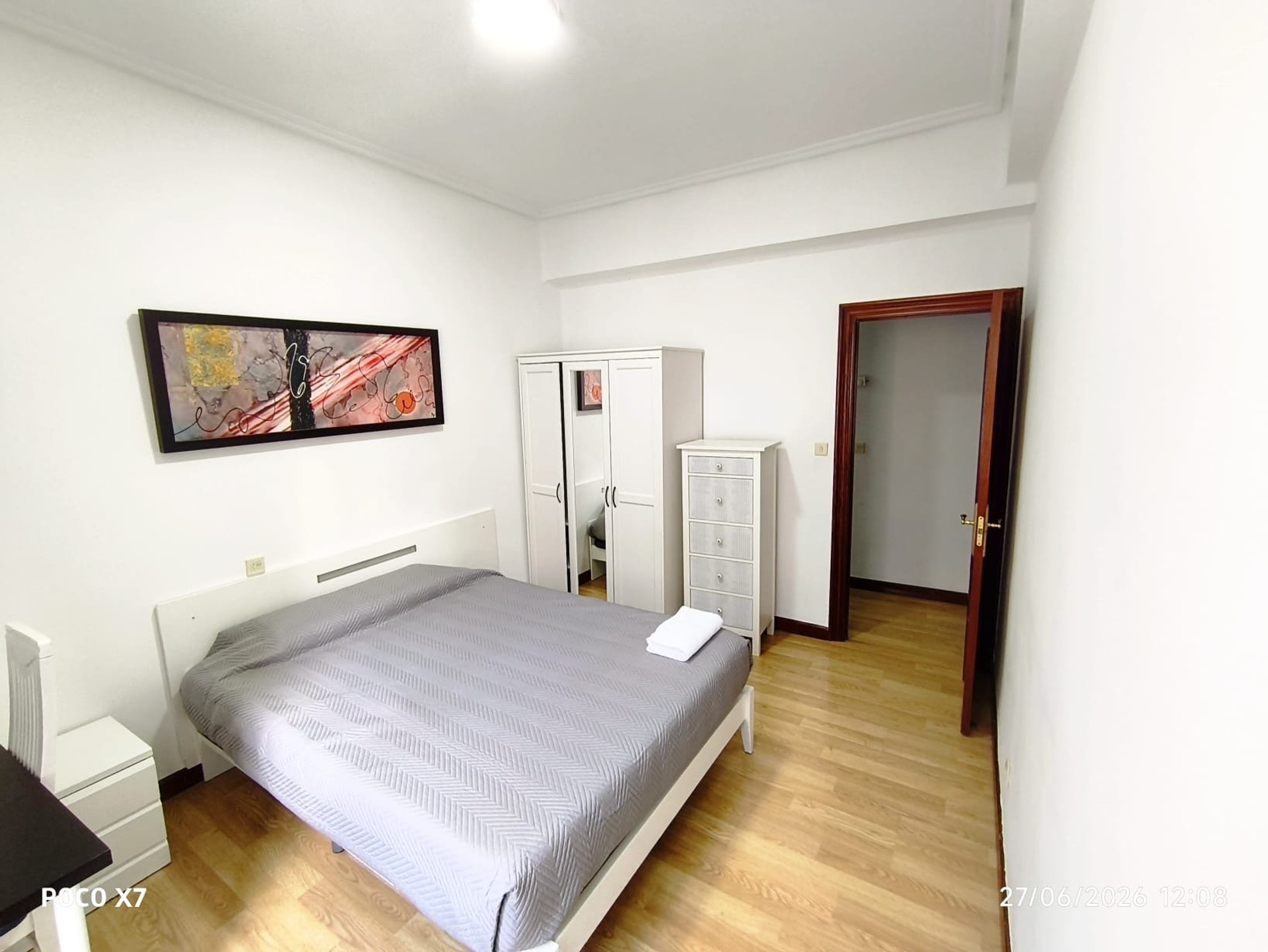 Double bedroom with white furniture