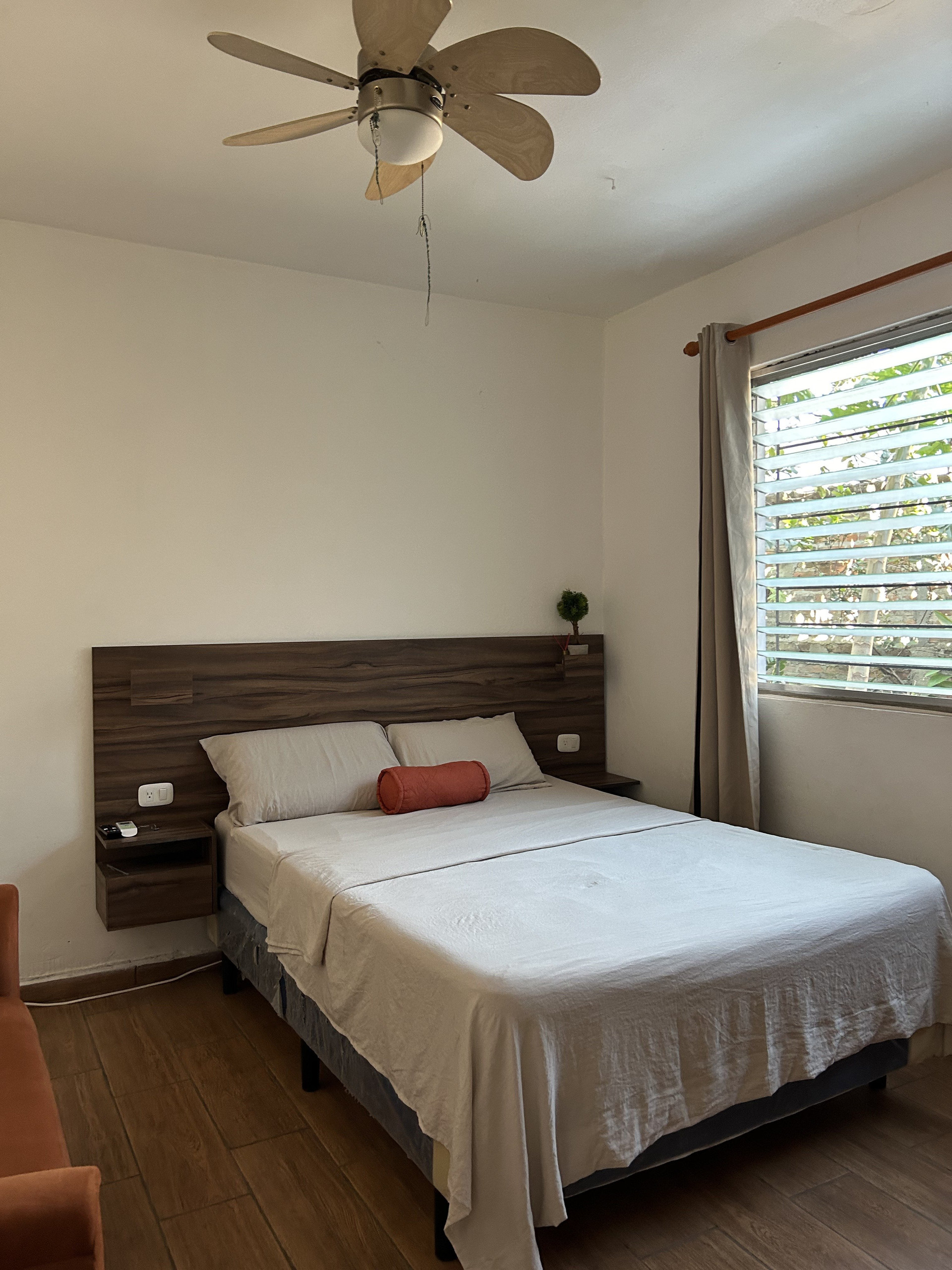 Bright bedroom with ceiling fan