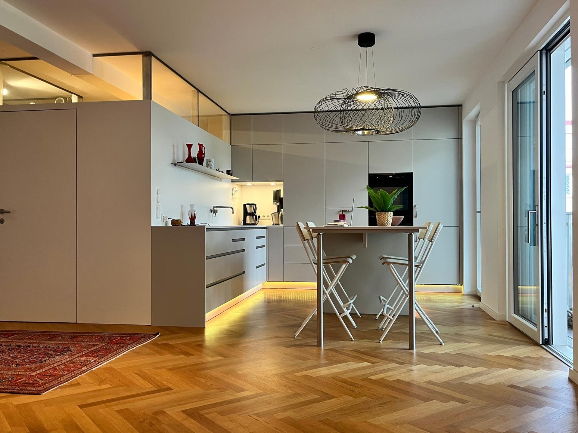 Modern kitchen with dining table