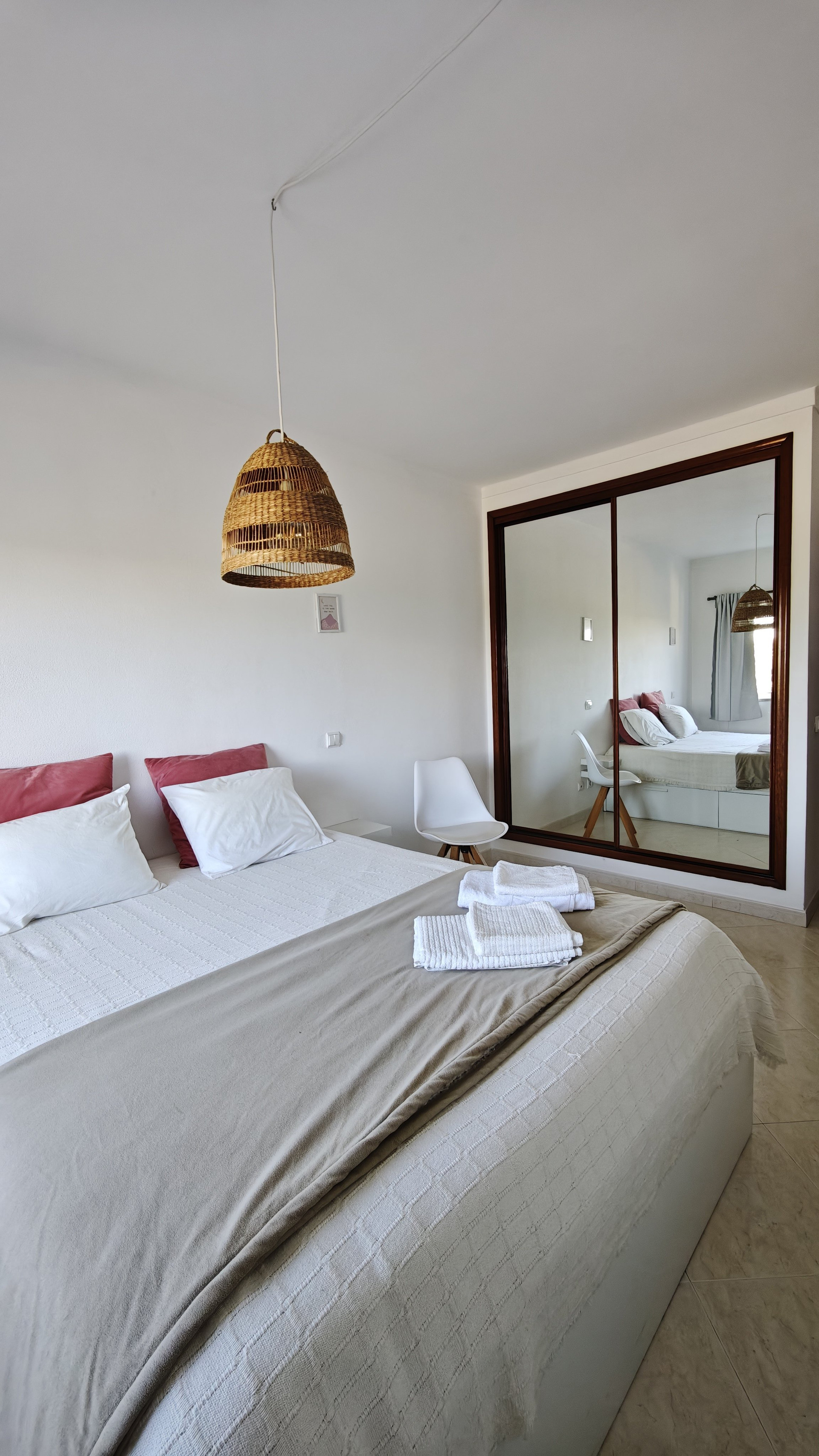 Bedroom with double bed and mirror