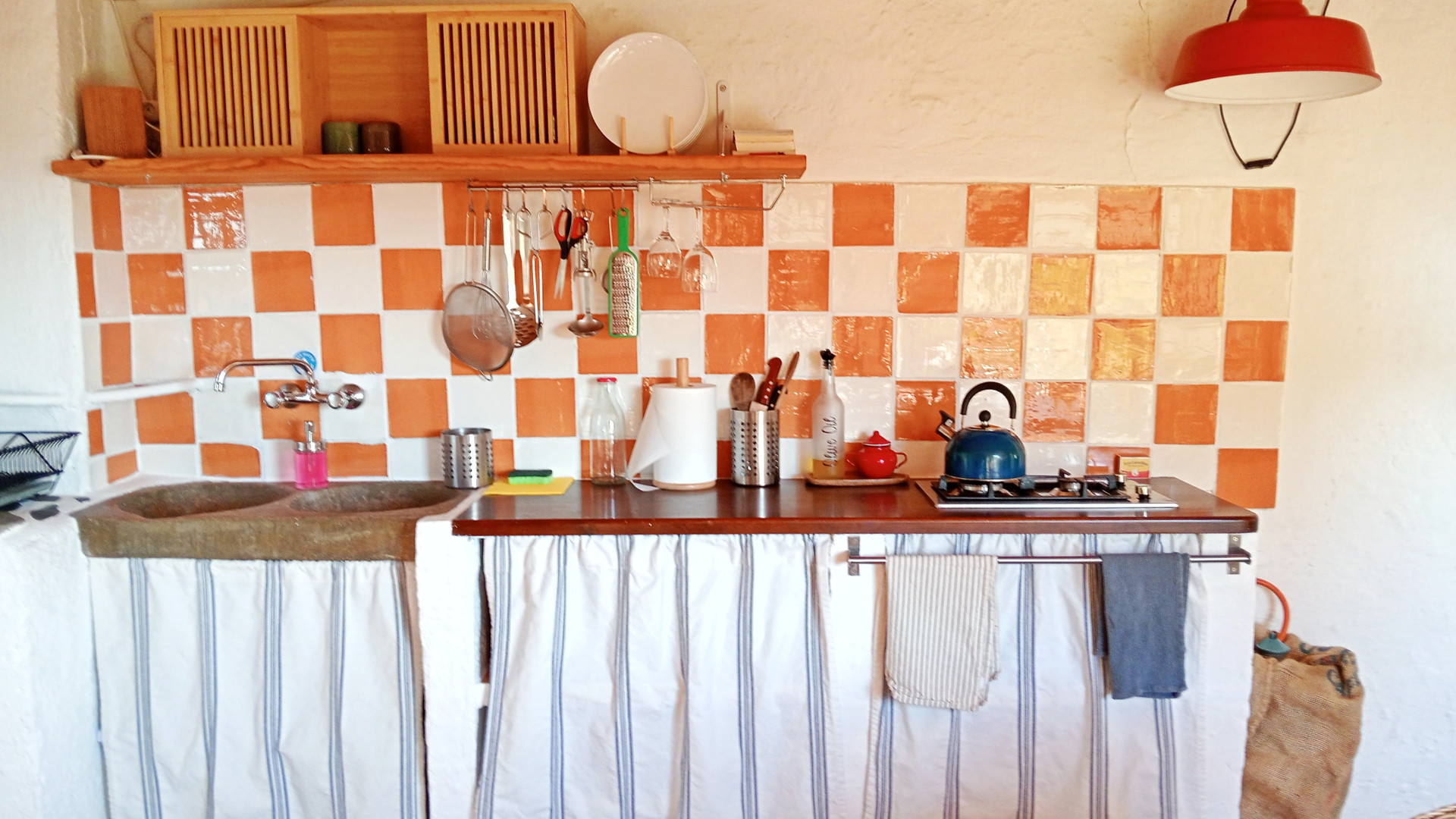 Rustic kitchen with orange checkered tiles