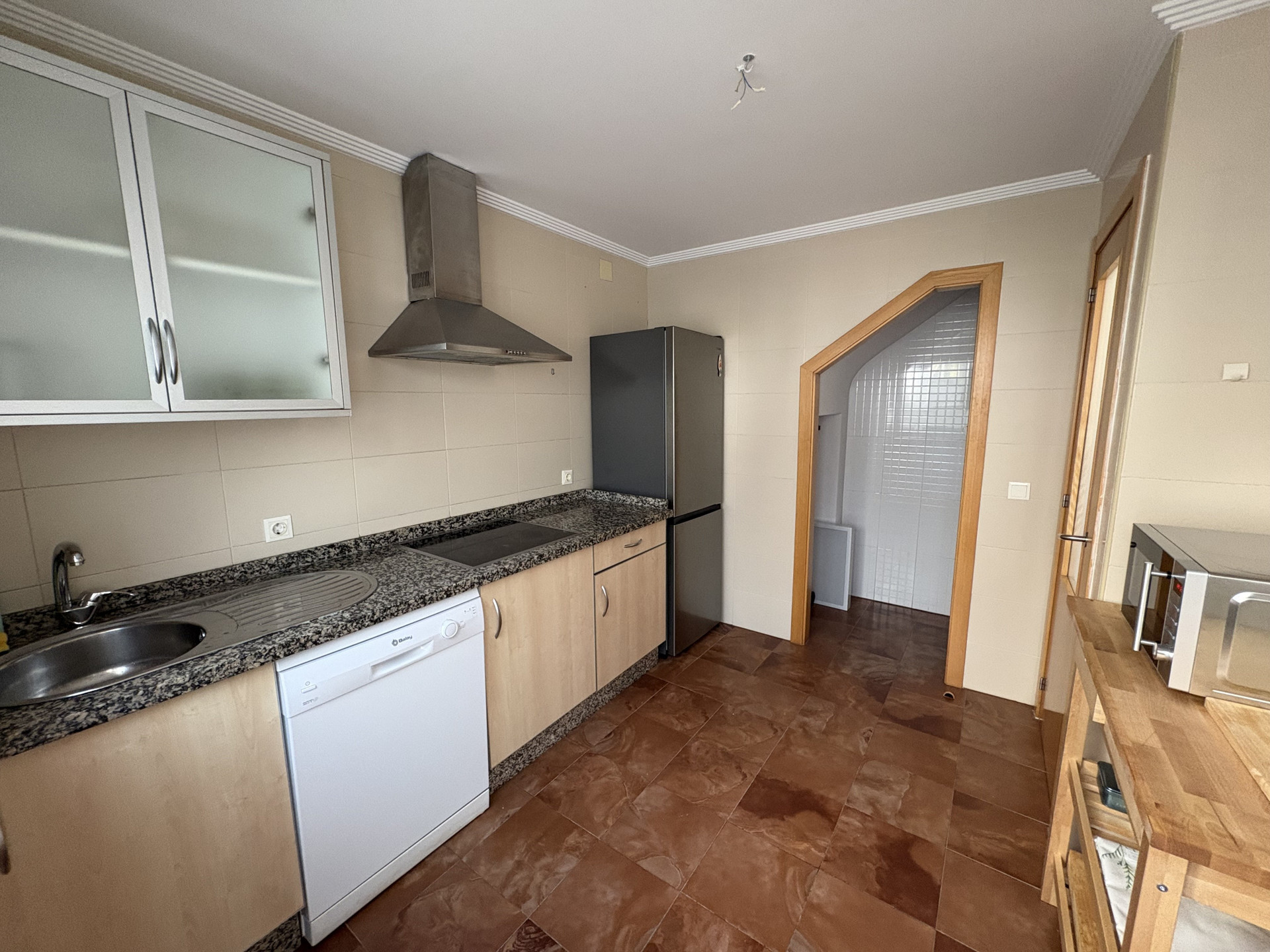 Kitchen with fridge and dishwasher