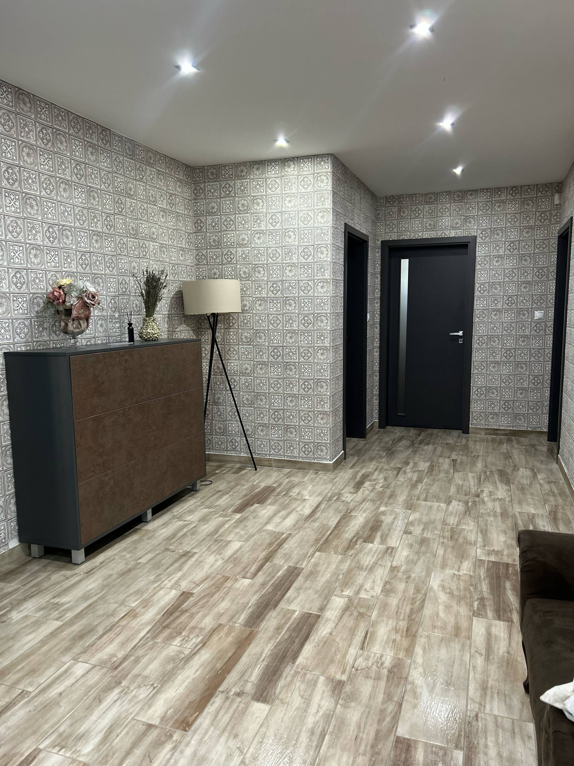 Hallway with patterned wallpaper