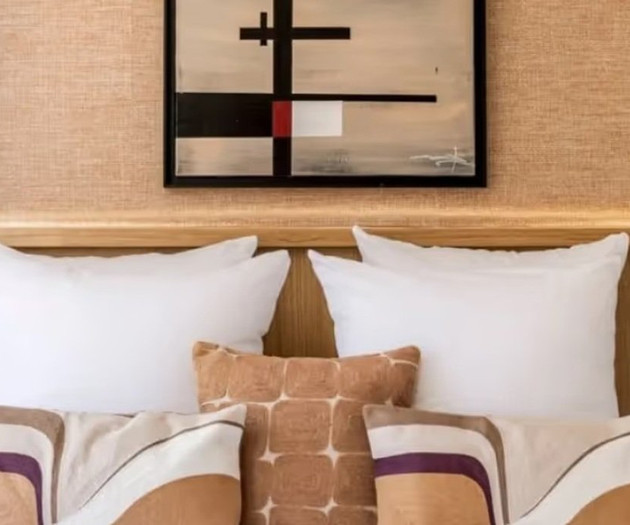 Bed pillows and framed art