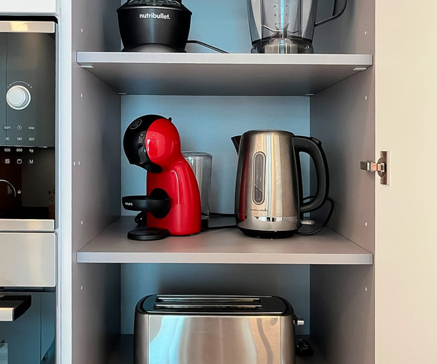 Kitchen appliances in cabinet