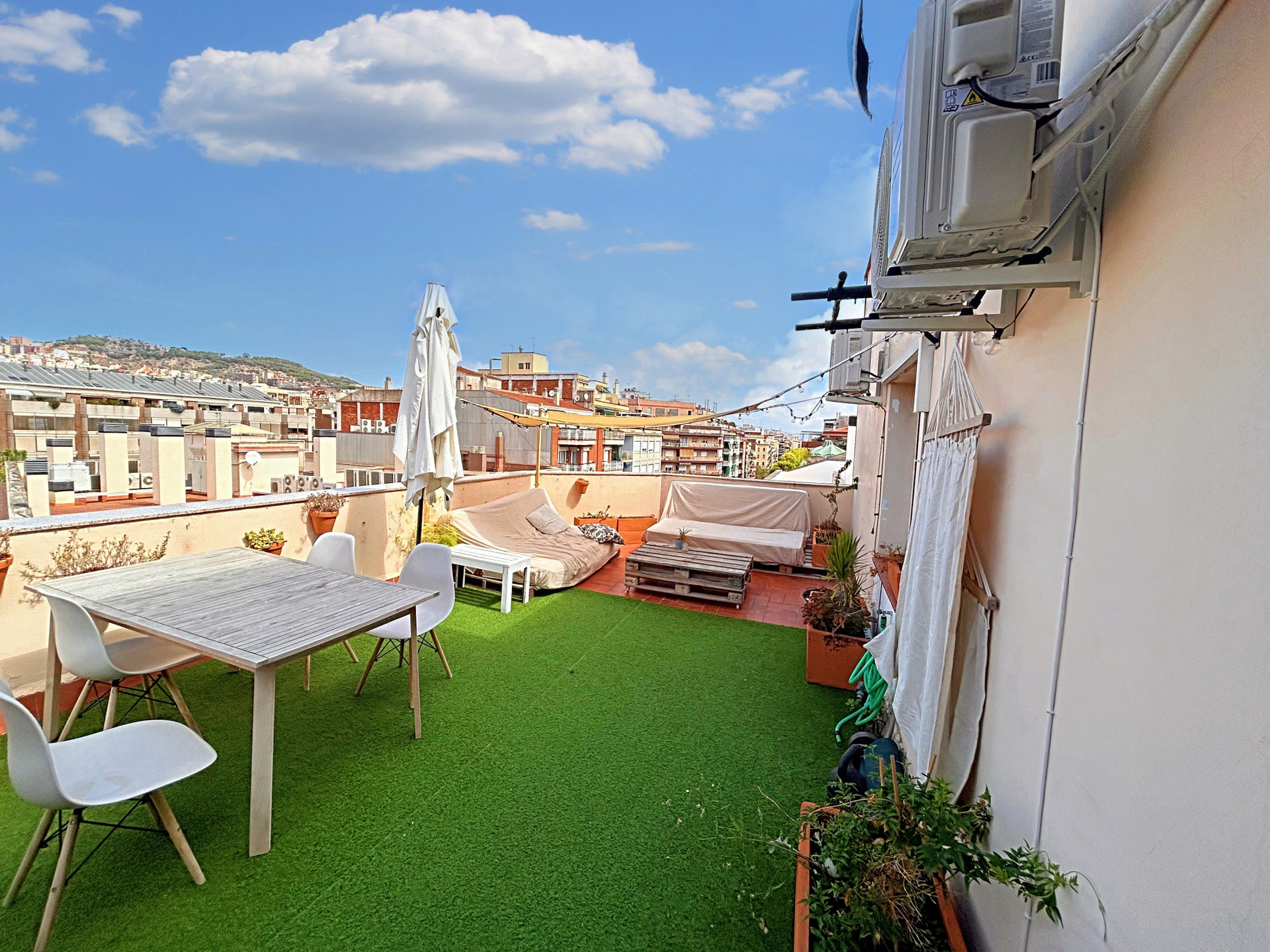 Terrace with hammoc, pullup bar, bicep bar and kettlebell for training