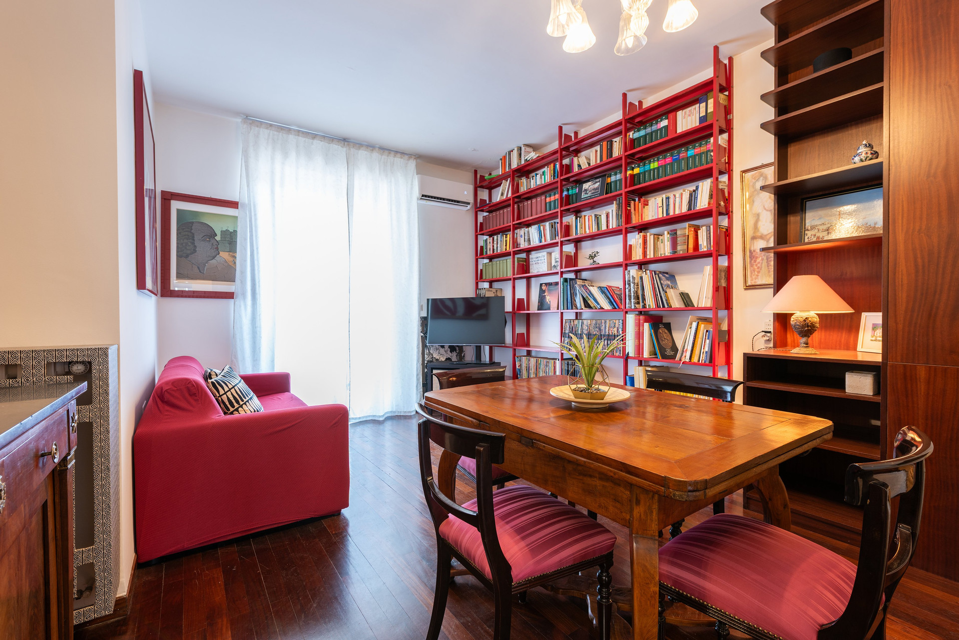 Living area with red bookshelves