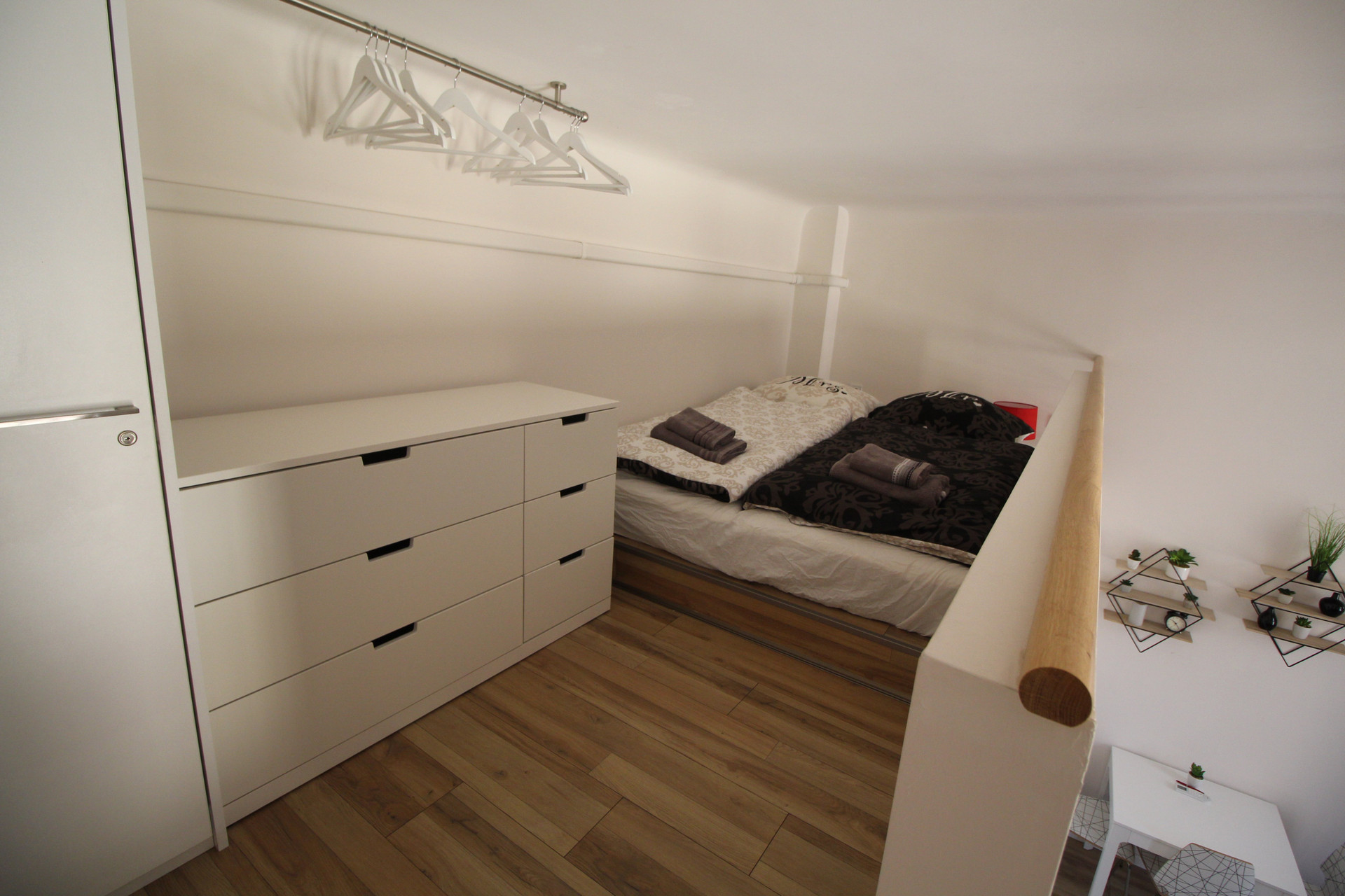 Mezzanine bedroom with storage dresser