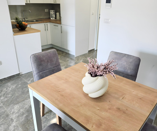 Dining table with kitchen view