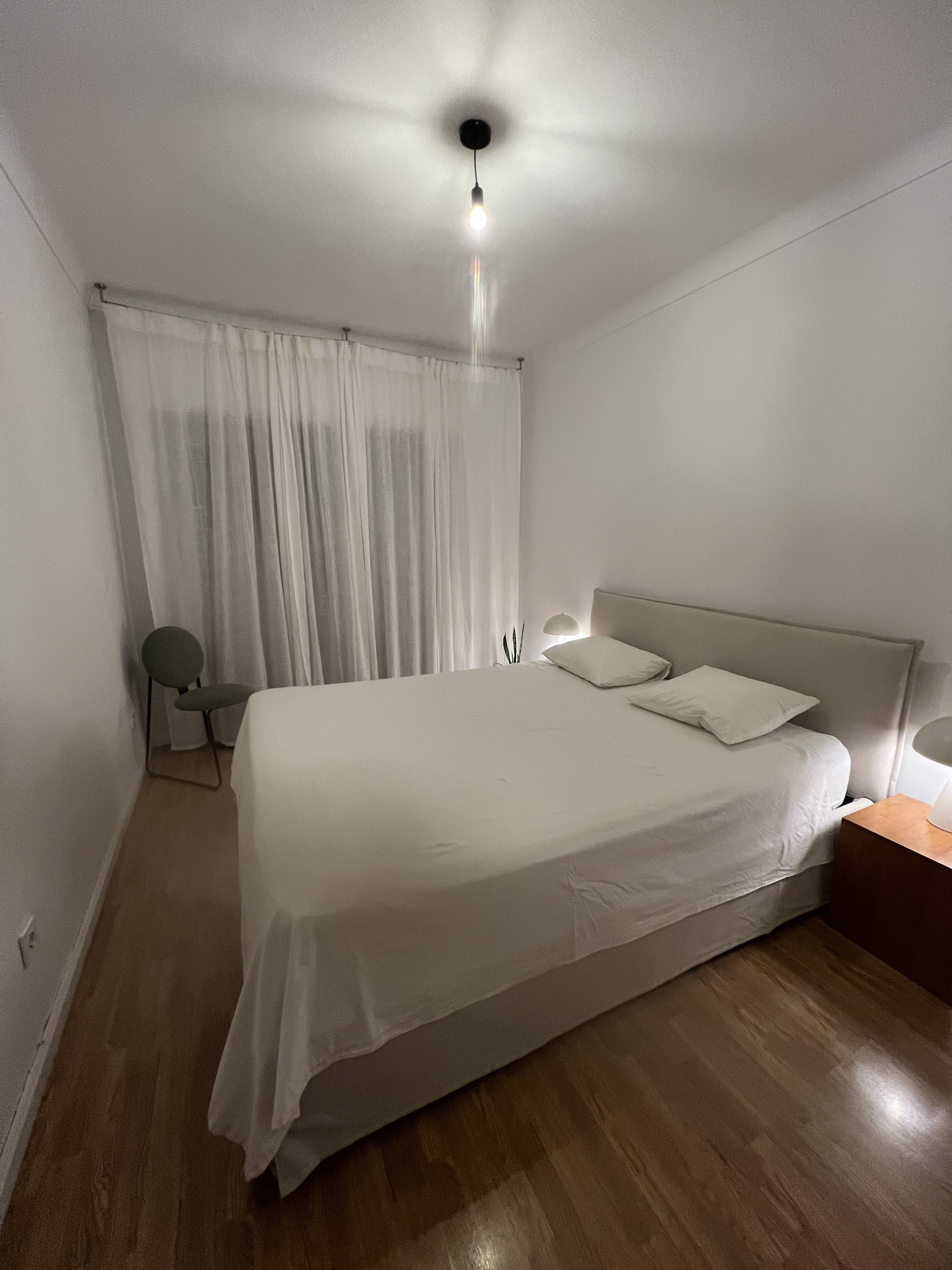 Bedroom with large white bed