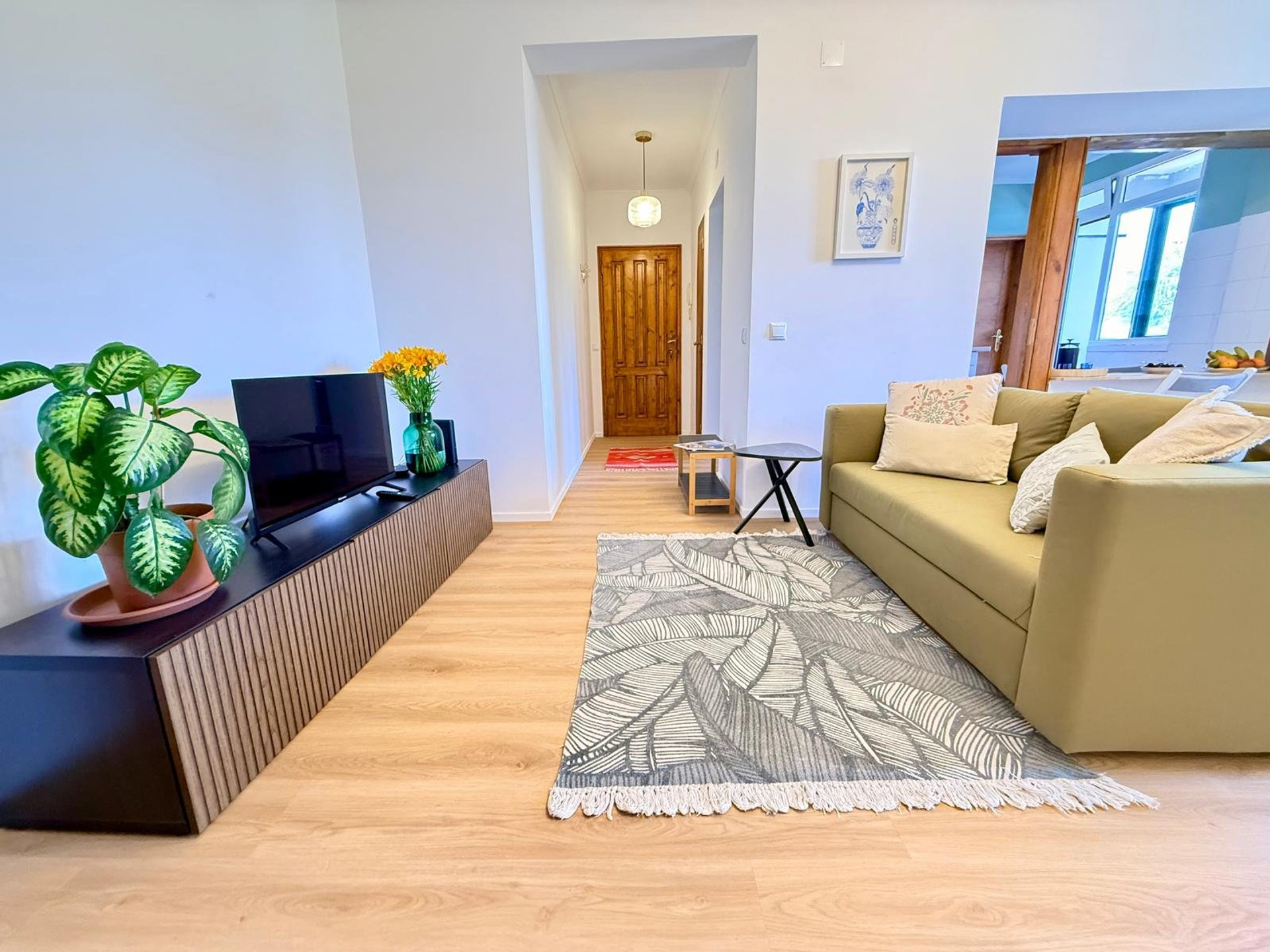 Living room with sofa and hallway