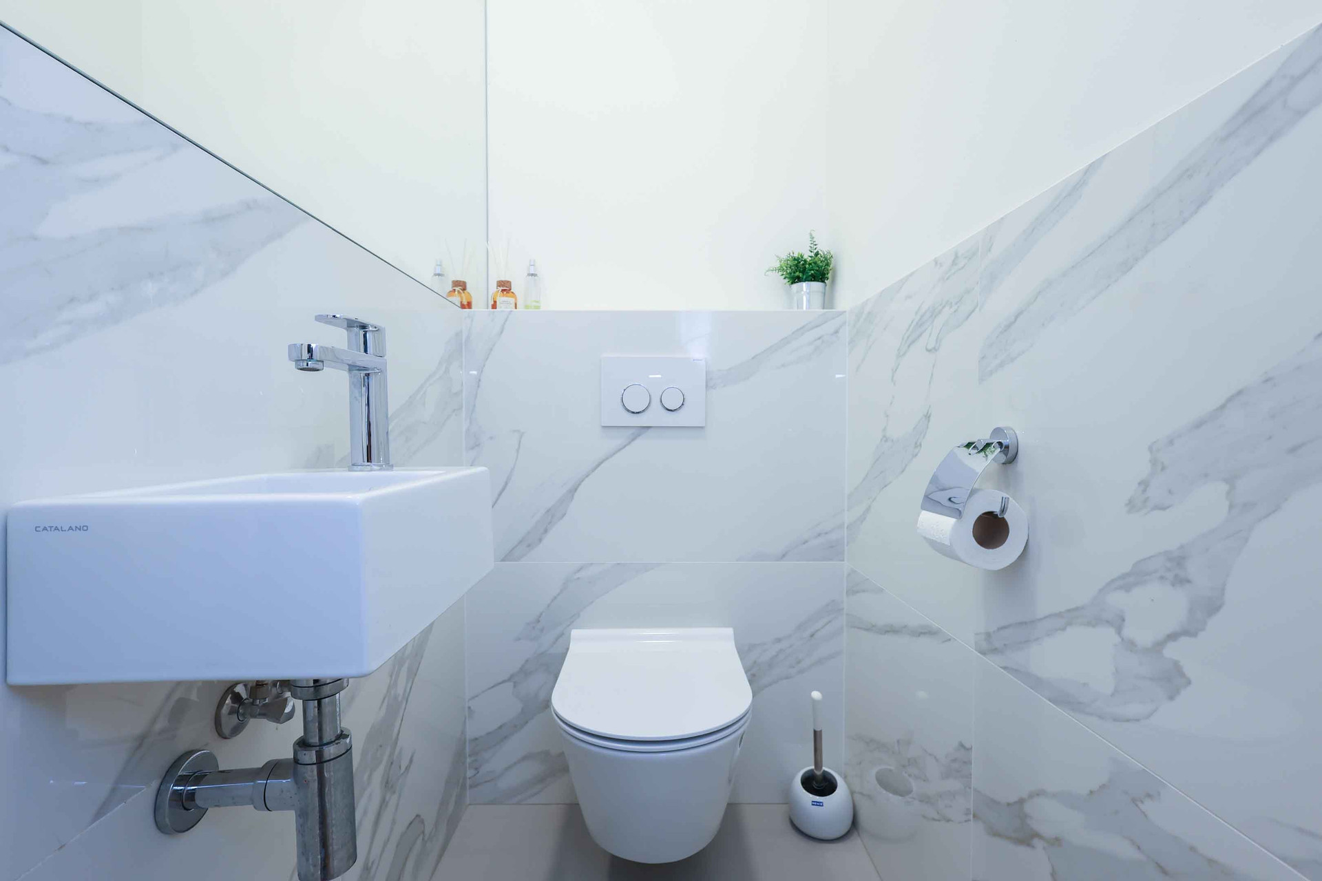 Modern marble bathroom with toilet
