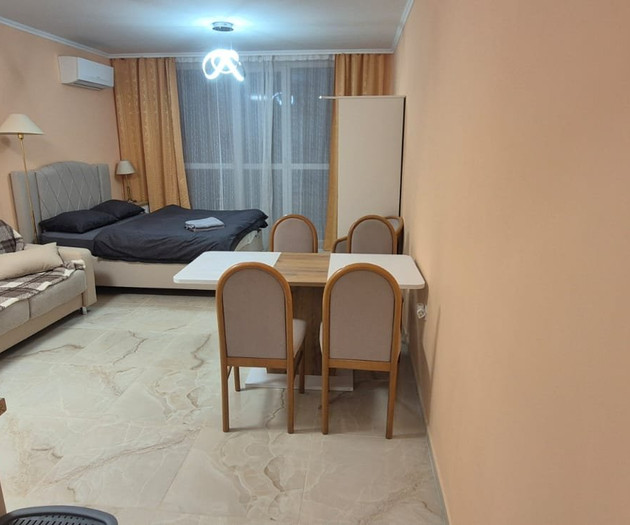 Light studio with balcony close to sea and center