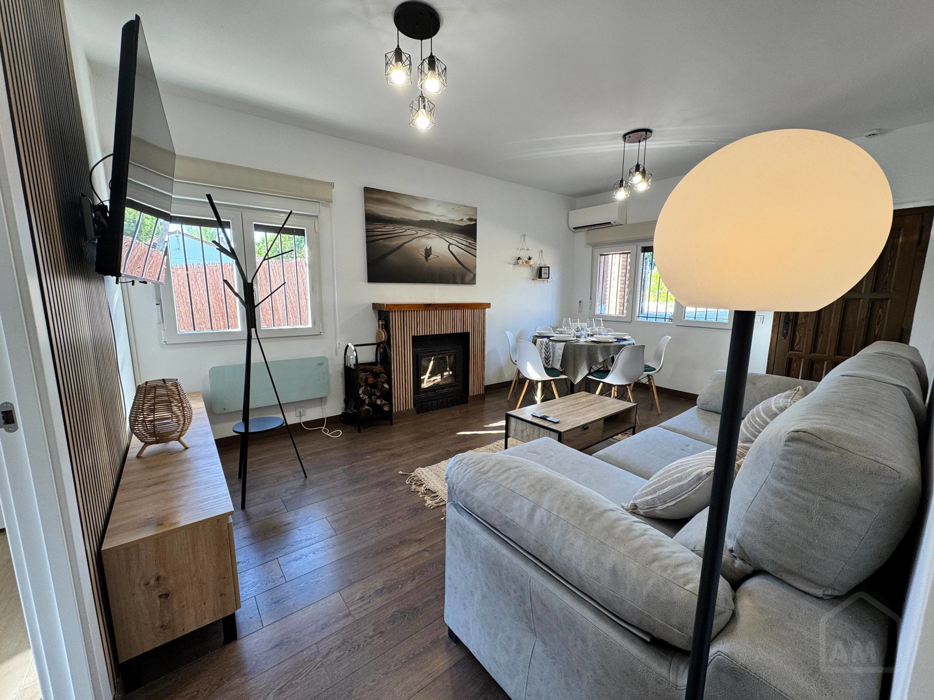 Living room with fireplace and dining