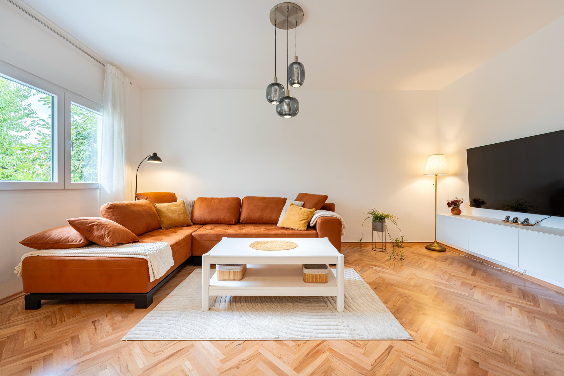 Bright living room with corner sofa