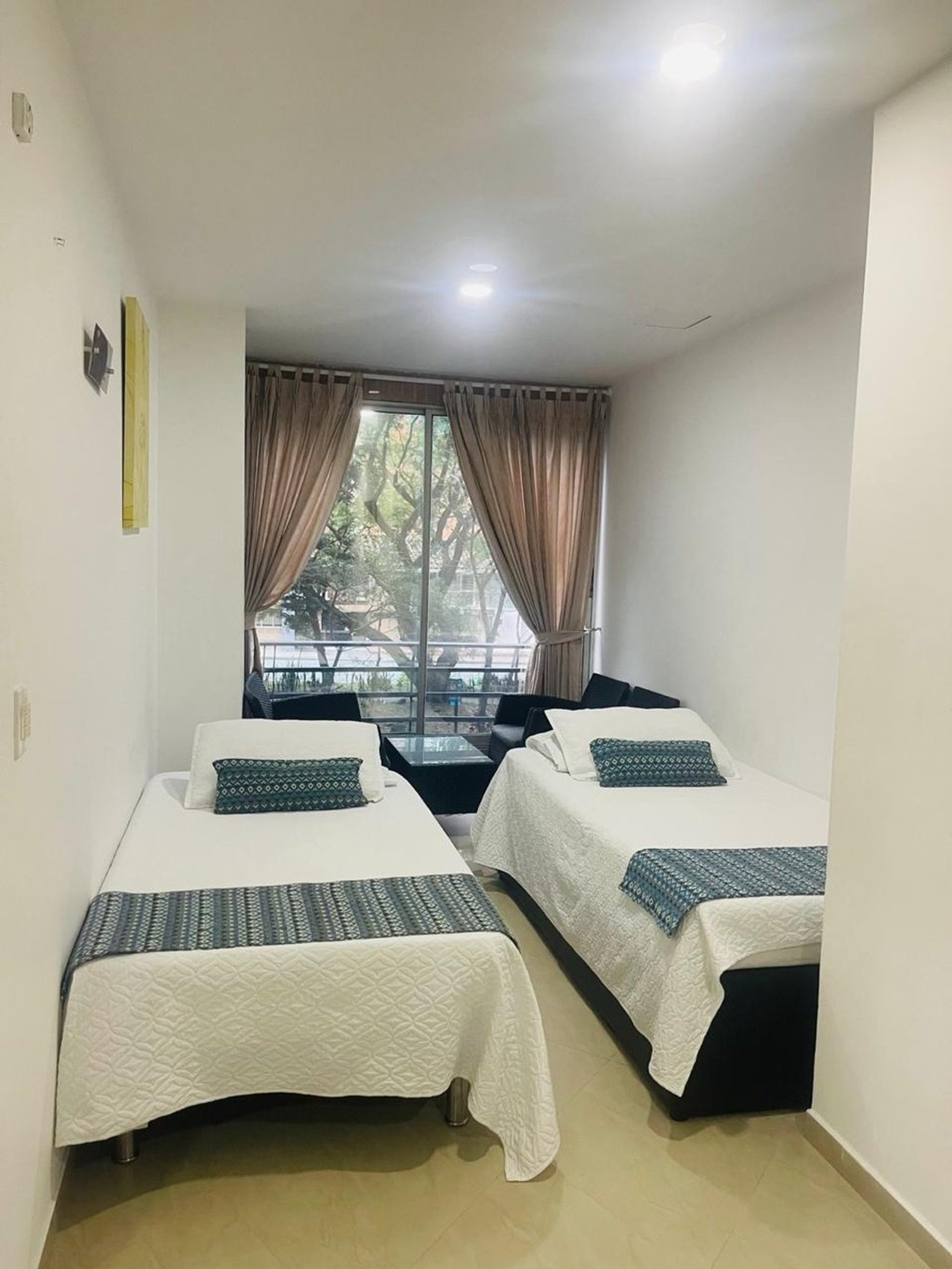 Twin beds with balcony view