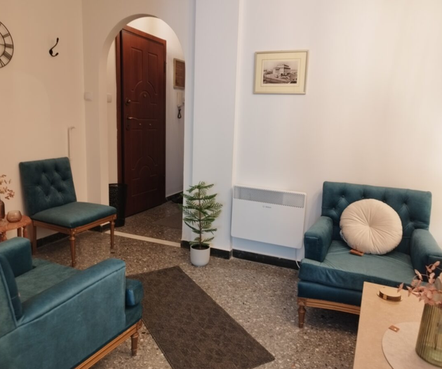 Living room with teal armchairs