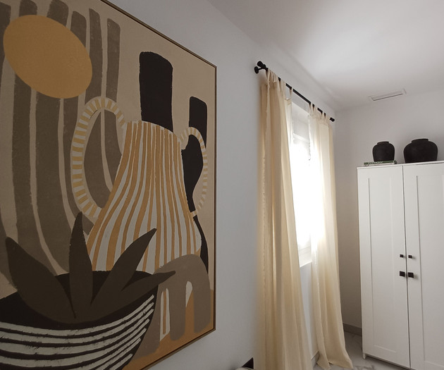 Twin bedroom with artwork detail