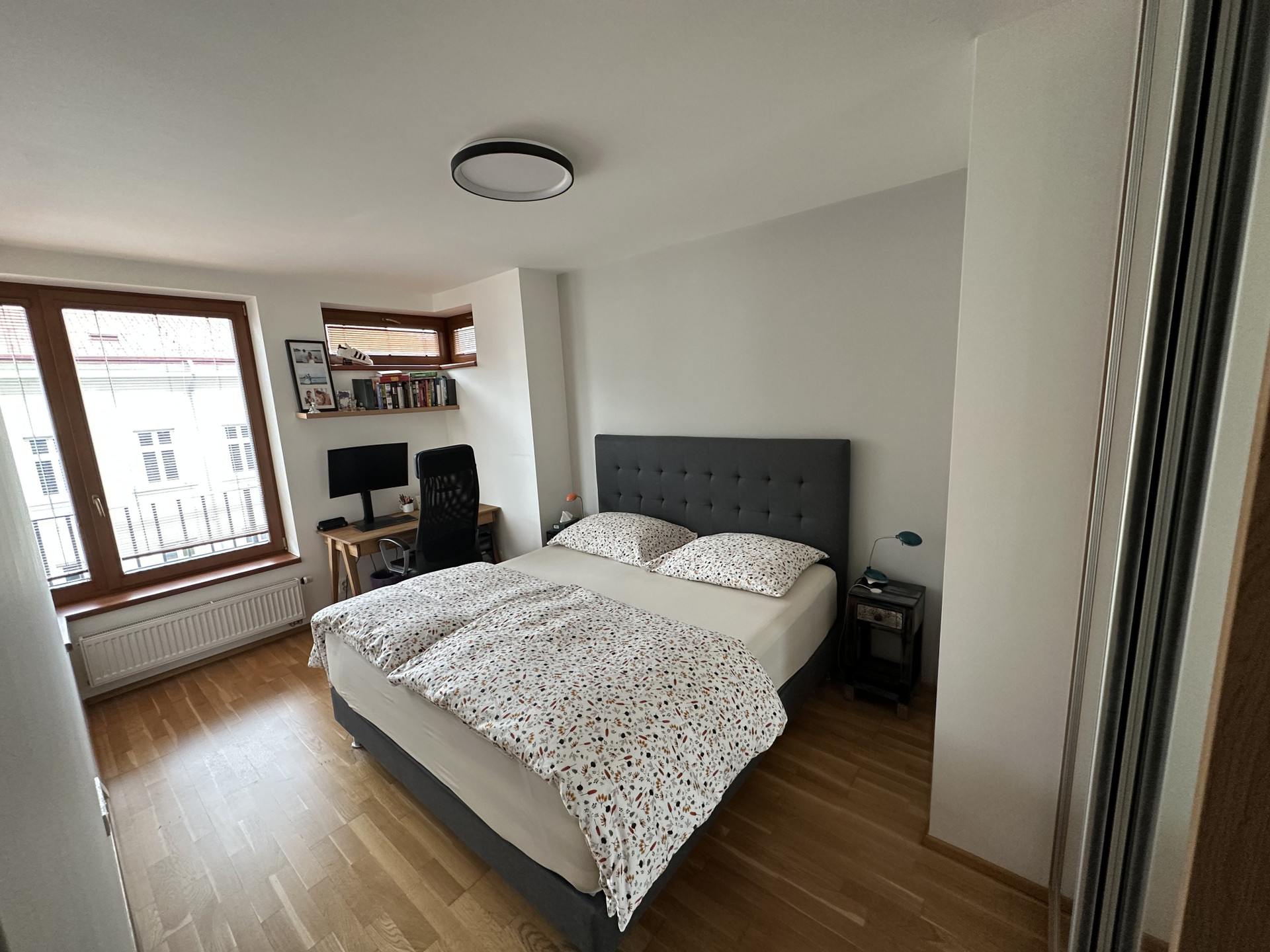 Bedroom with double bed and desk