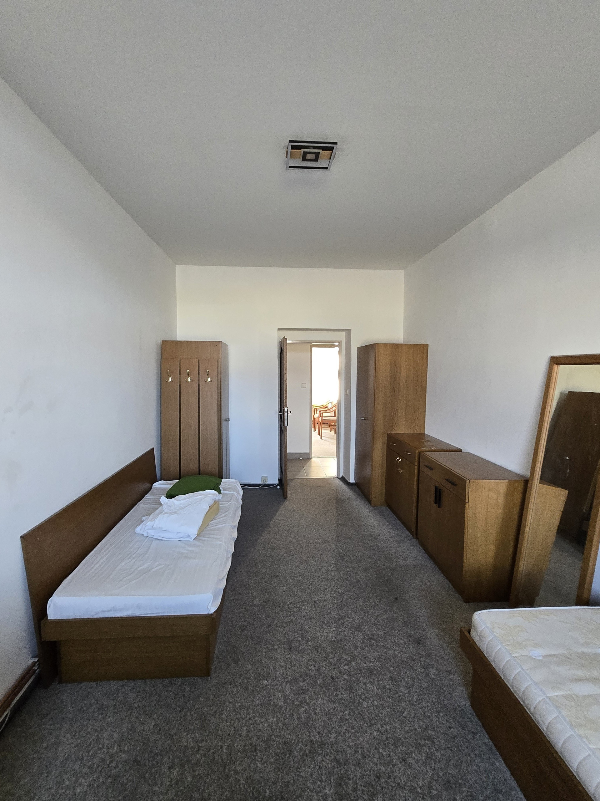 Bedroom with dresser and mirror