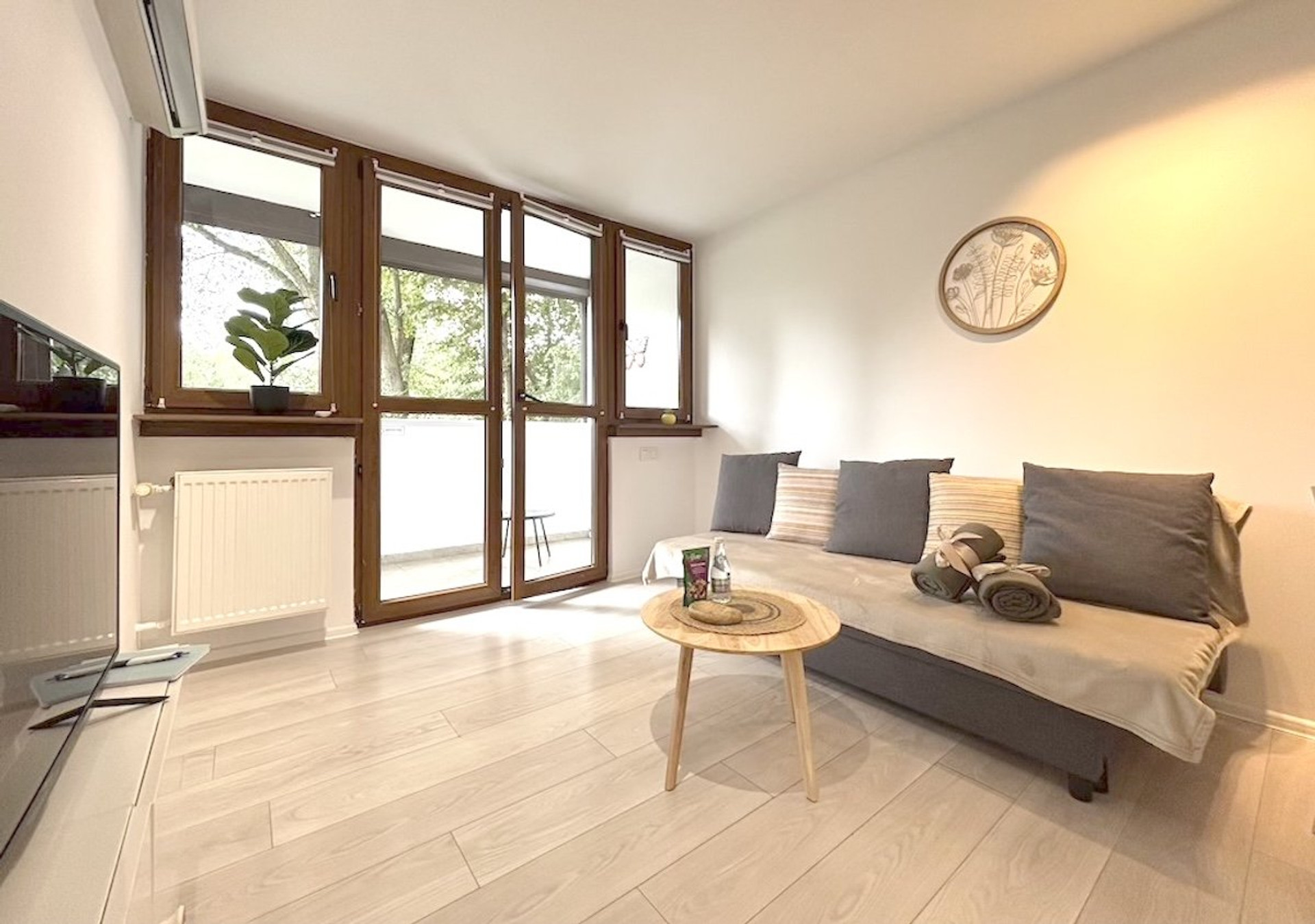 Bright living room with balcony access
