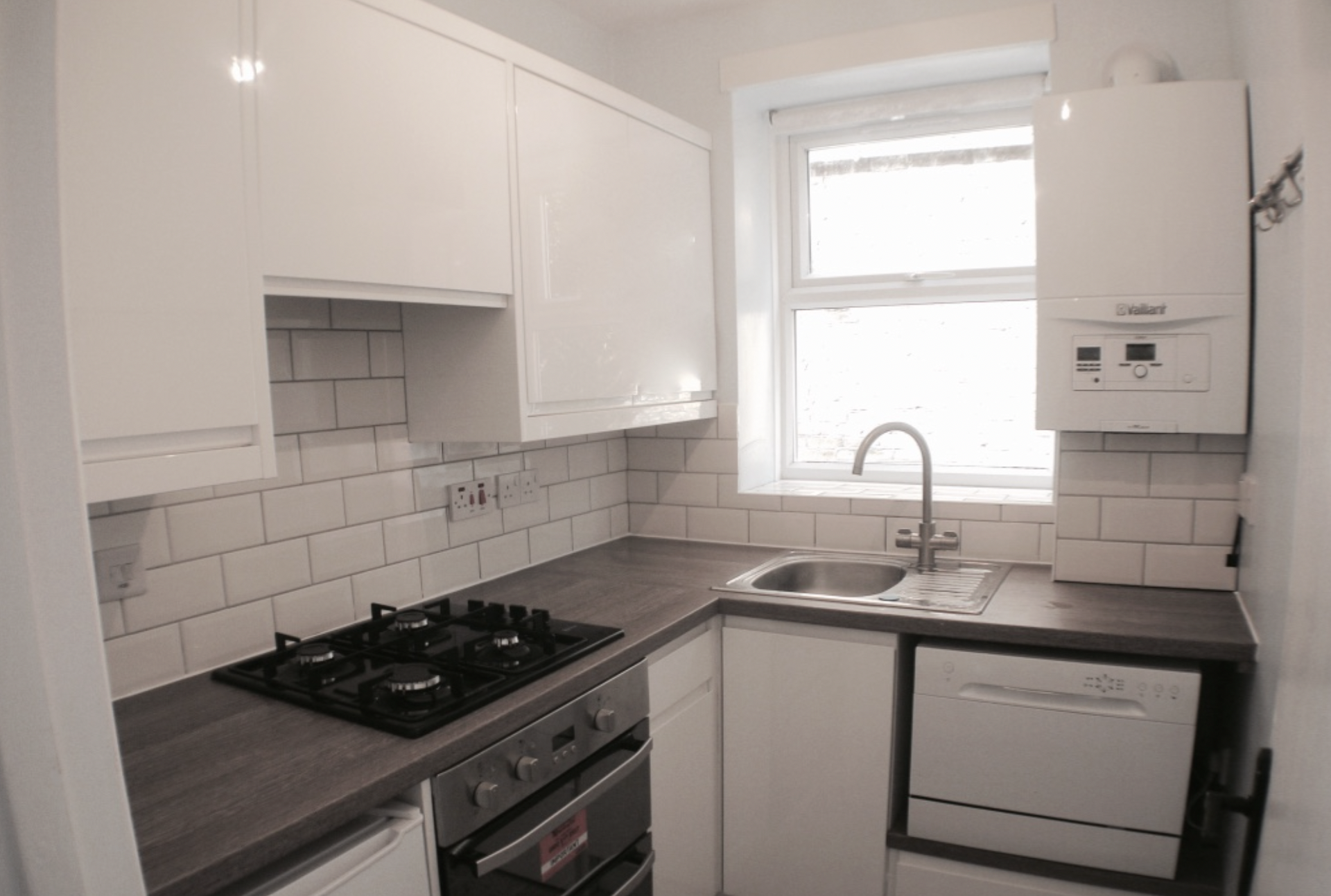 White kitchen with gas hob