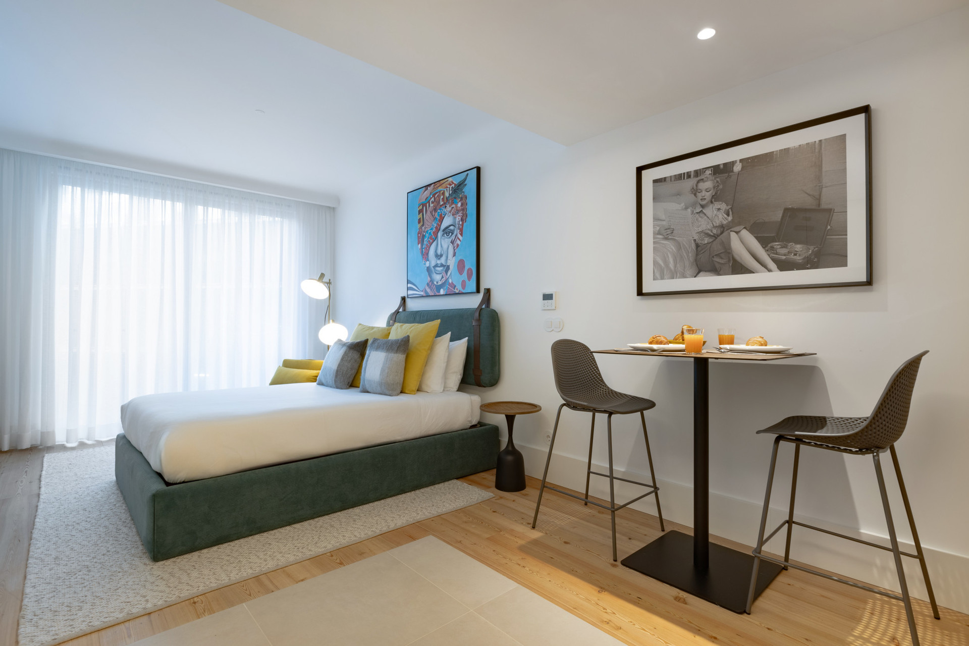 Living Area with a Double Bed and Dining Table for 2