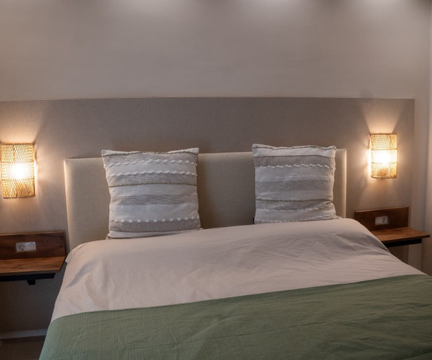 Bed with bedside lamps