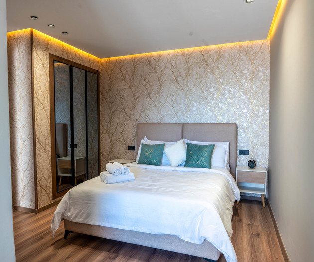 Bedroom with wallpaper accent wall