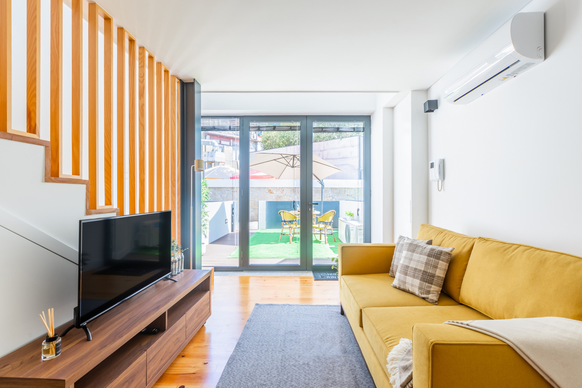Living Room with A/C and Flat-Screen TV