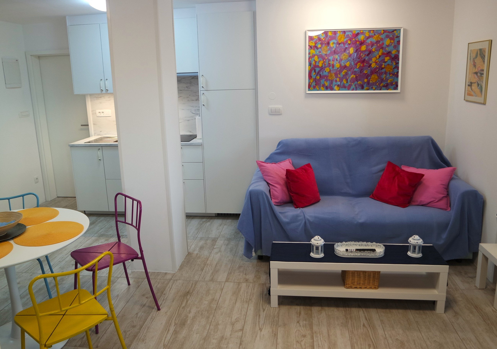 Living room with sofa and kitchen